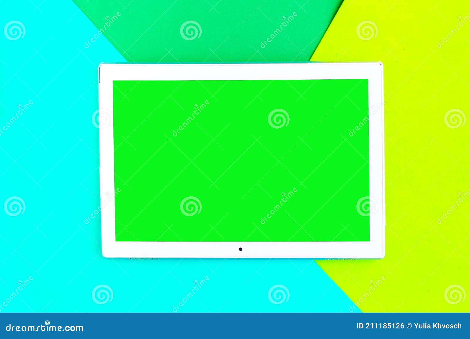 Tablet Device with Green Screen on Color Geometric Background Stock