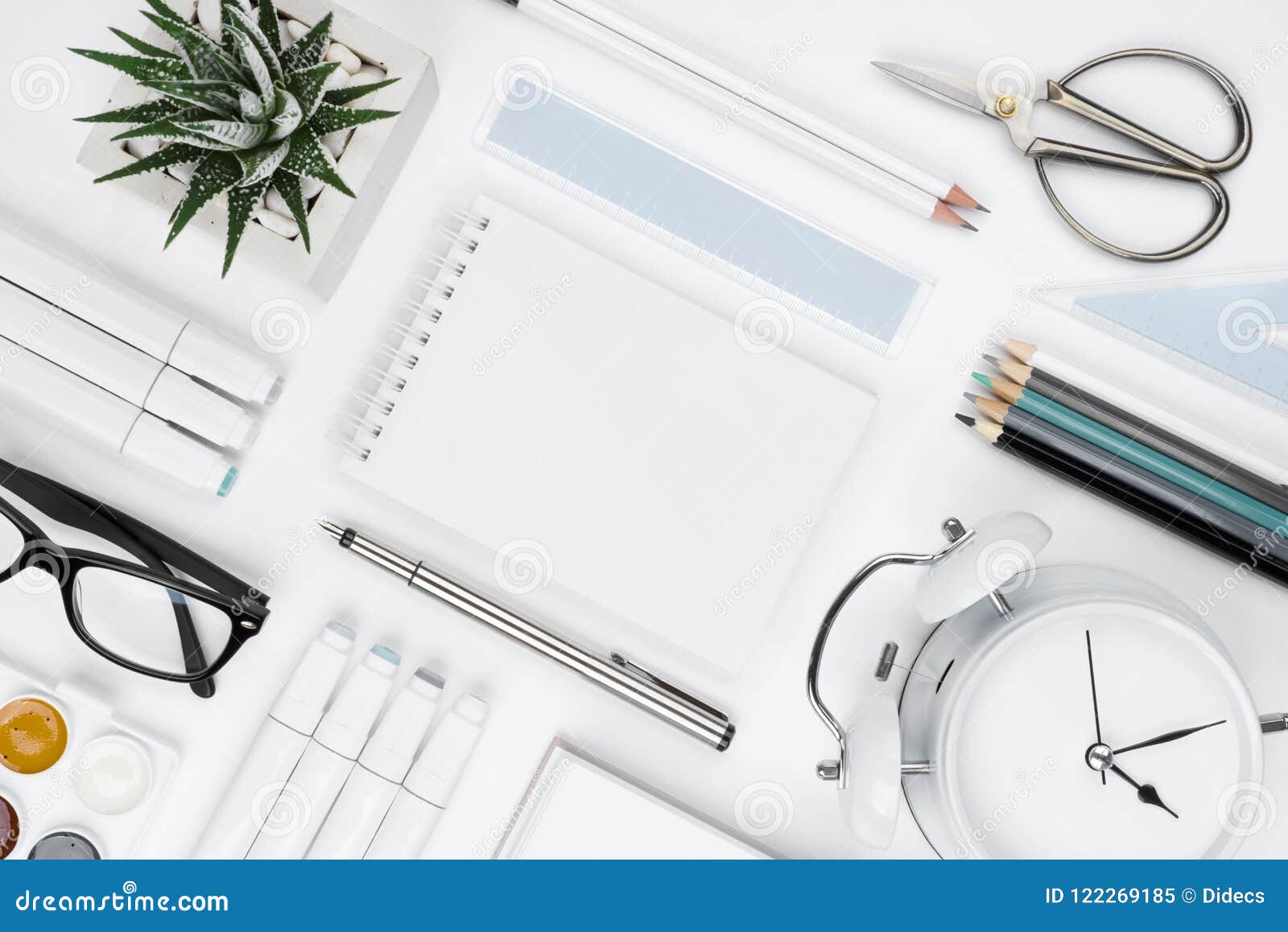 White Tabletop with Office Supplies and Blank Notebook in Center Stock