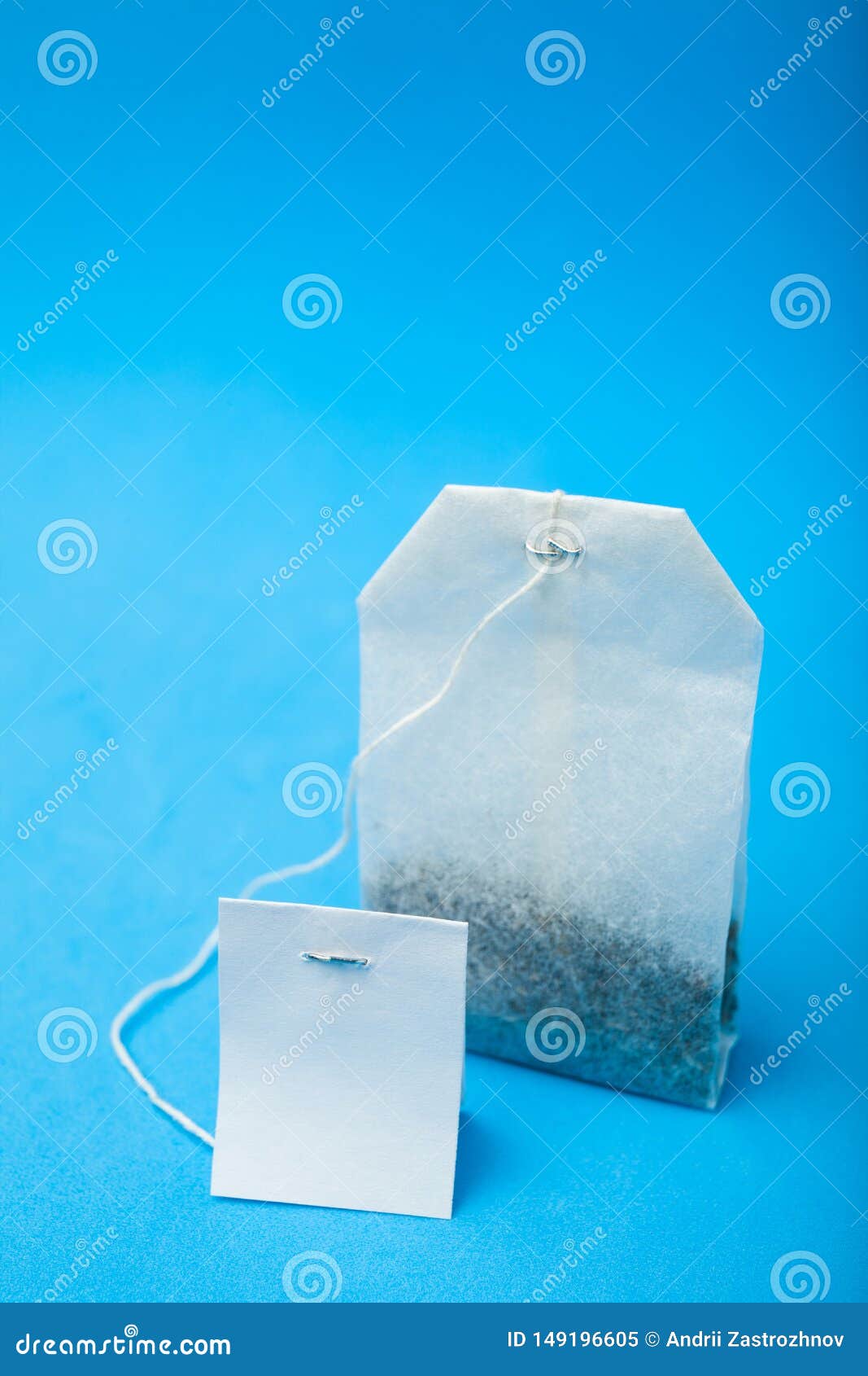 A White Tea Bag is Isolated on a Blue Background Stock Image Image of