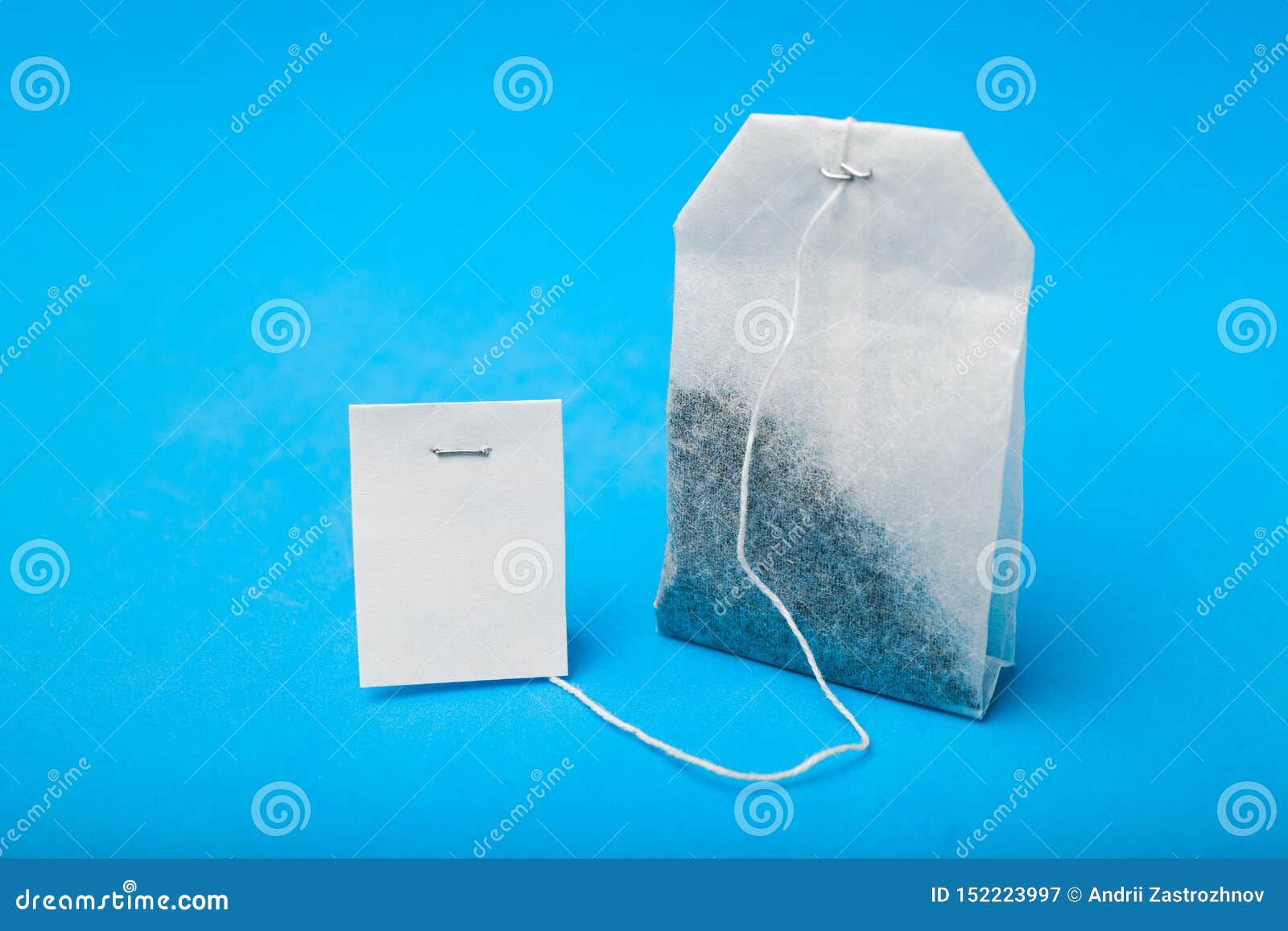 White Tea Bag Isolated on Blue Background Stock Image Image of