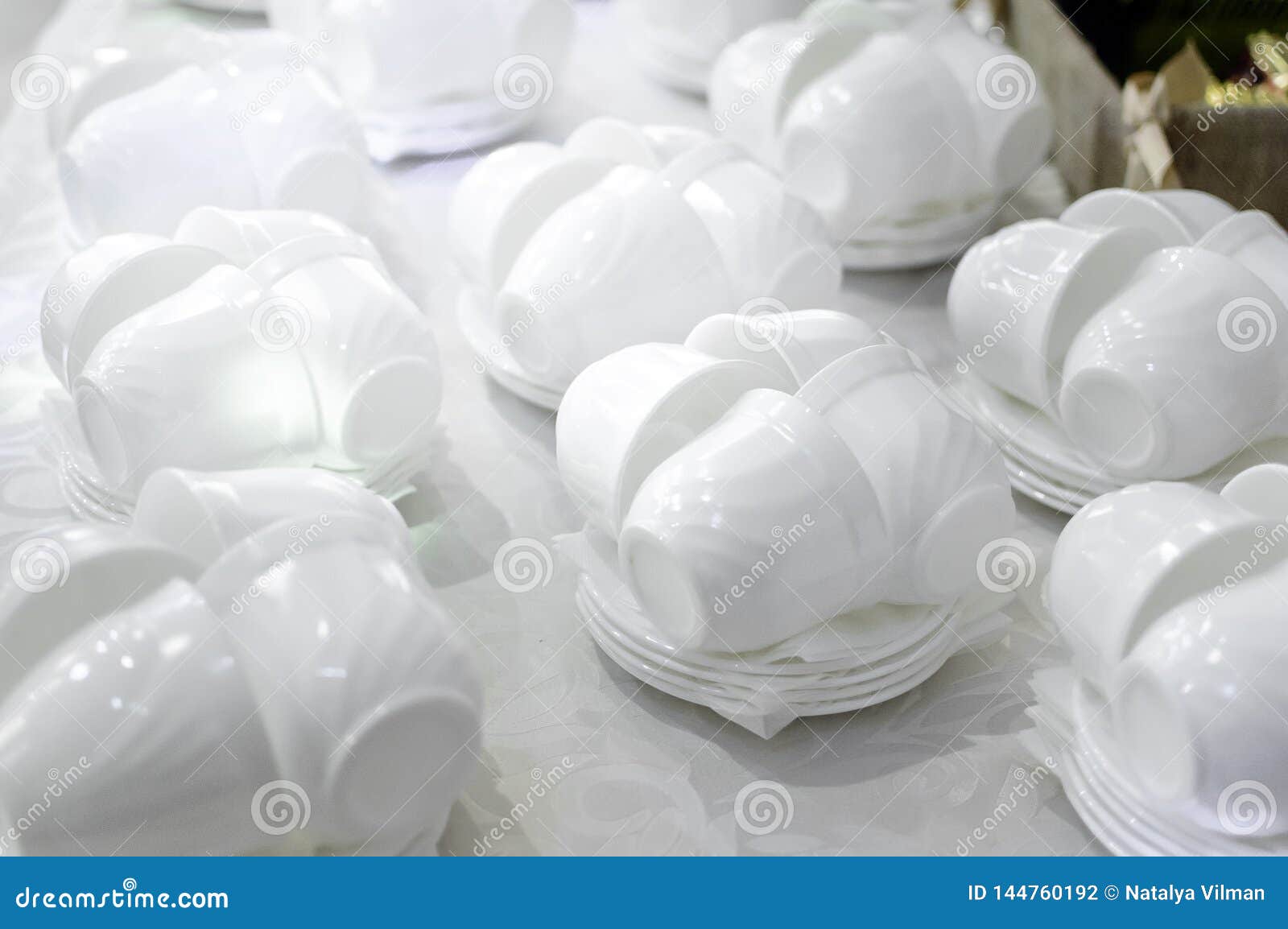 White tea cups and saucers stock photo. Image of beverage 144760192