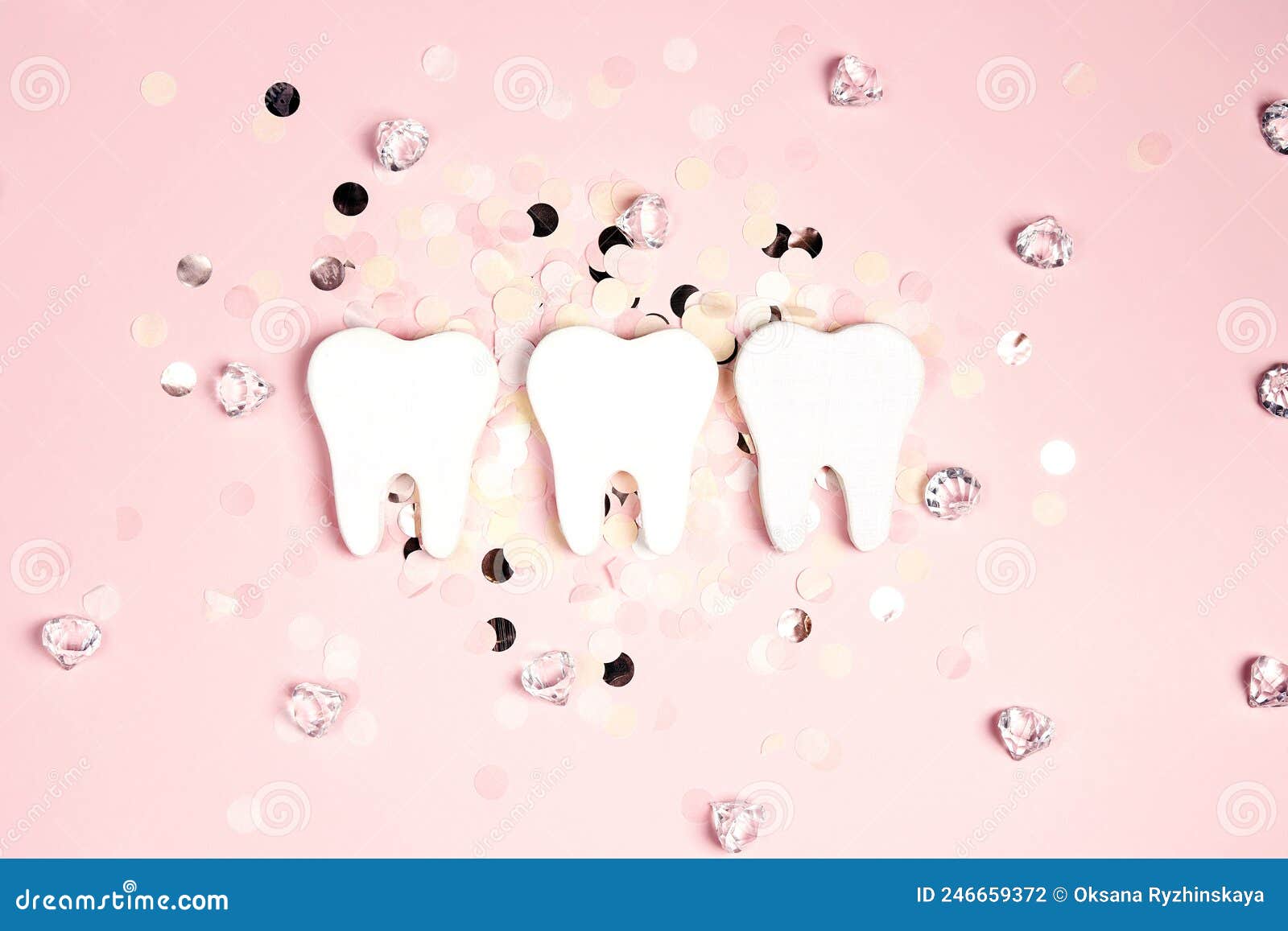 White Teeth on a Pink Background with Confetti and Crystals Stock Photo
