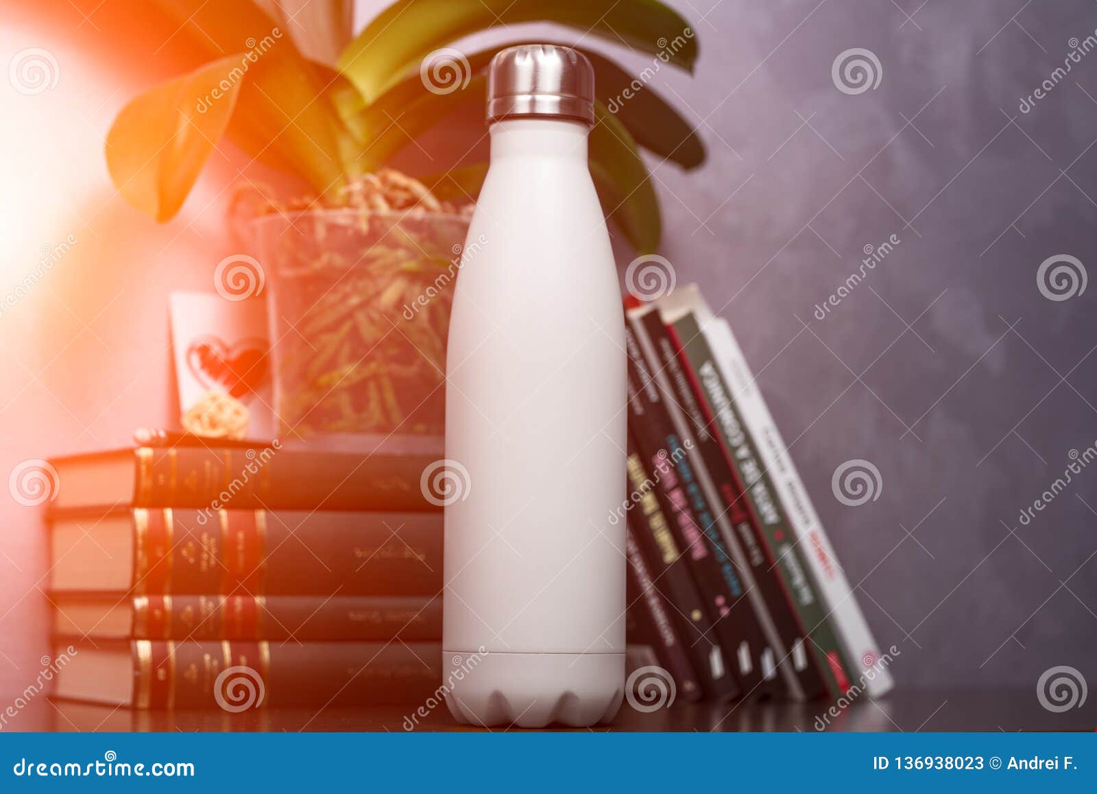 Download White Thermo Bottle With Blank Mockup Over Background Of Books And Green Flower Stock Image ...