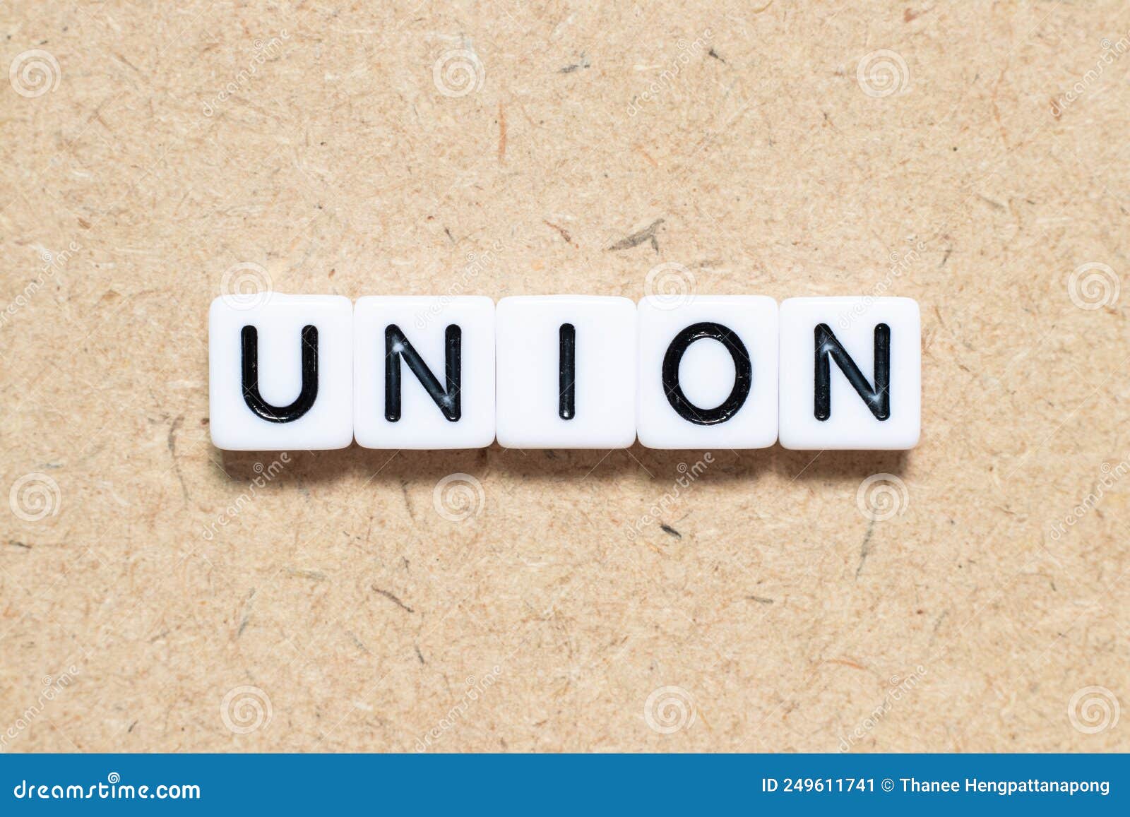 White Tile Letter with Word Union on Wood Background Stock Image White Tile Letter with Word Union on Wood Background Stock Image