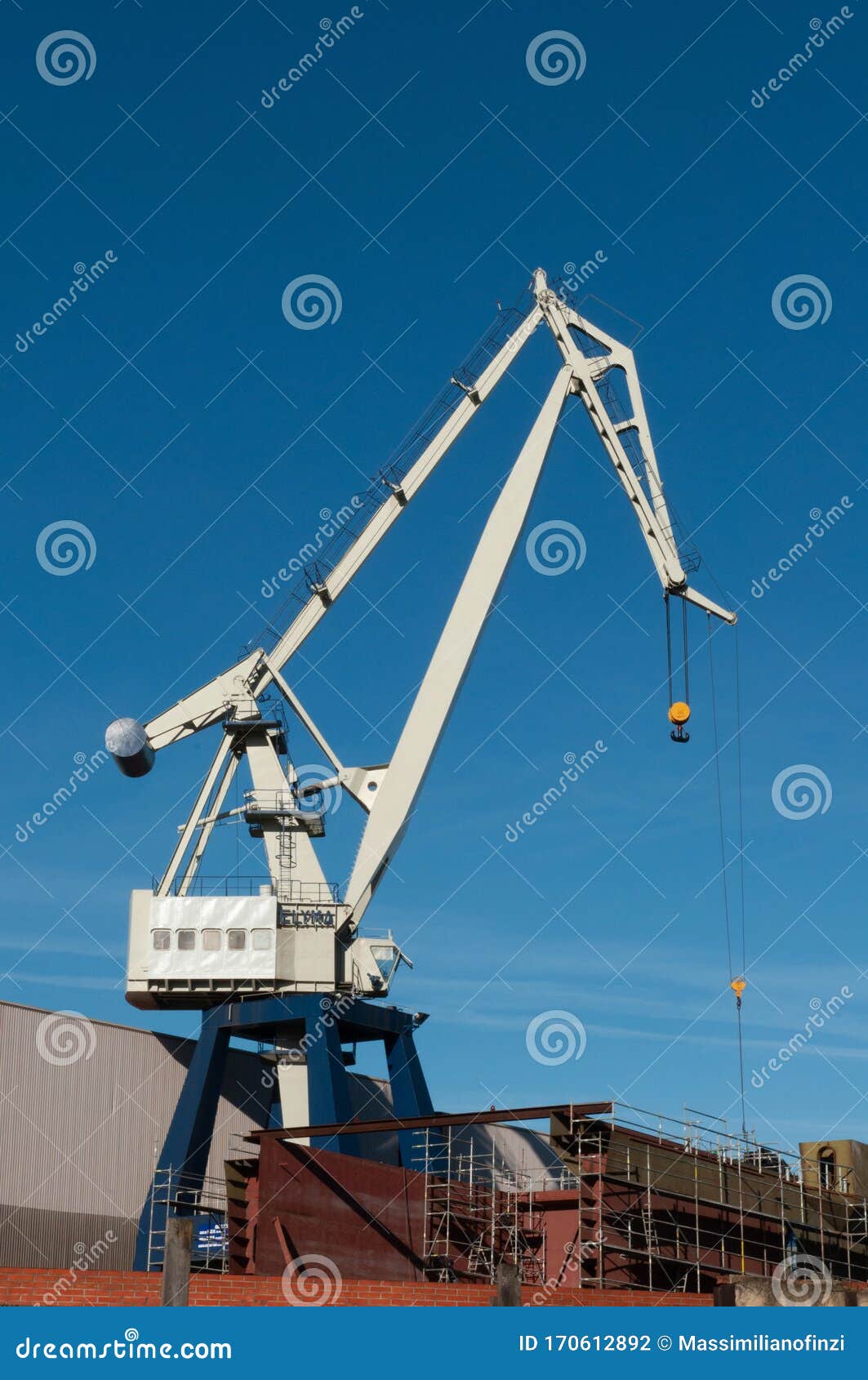 white tower crane with blue sky
