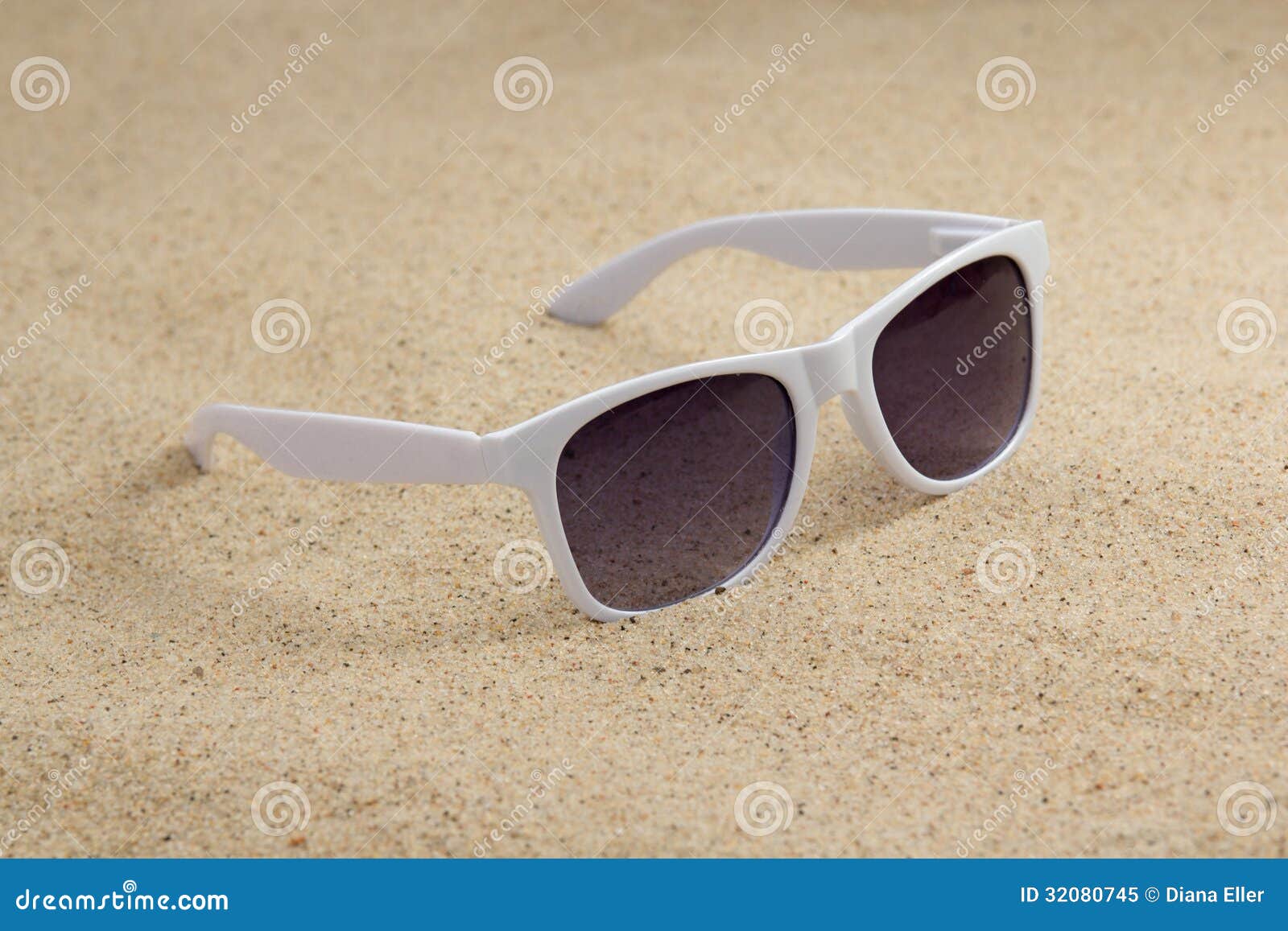 White Trendy Sunglasses On Beach Sand Royalty Free Stock