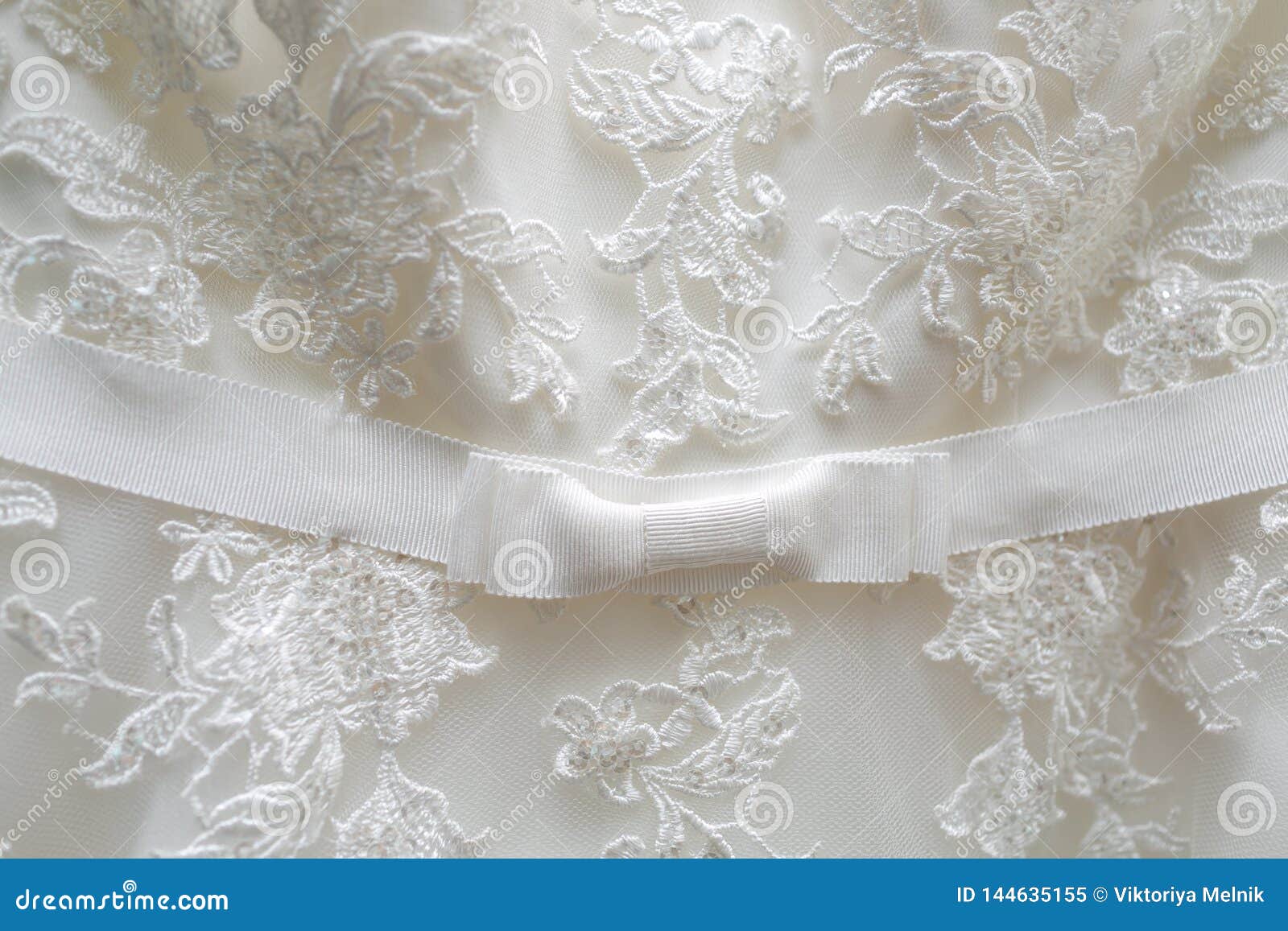 White Tulle Material with Patterns in the Shape of Flowers and a Bow in the  Middle. Stock Image - Image of clothing, material: 144635155