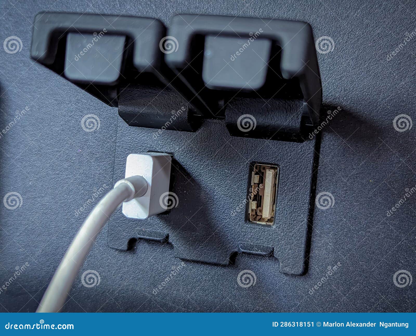 White USB Cable Connected To USB Port for Android Auto with One Extra