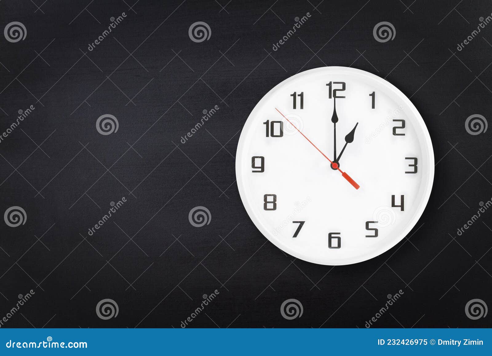 white wall clock on black chalkboard background. one 1 a.m. or 1 p.m.