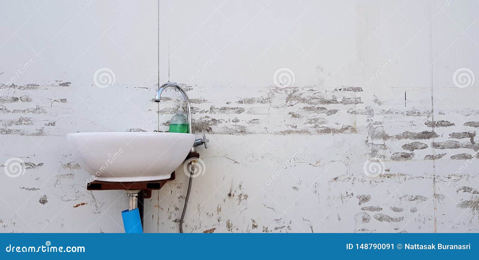White Wash Basin Or Sink By Human Made Or Installed On White