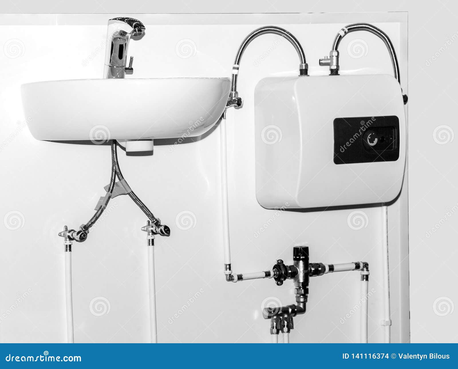 White Washbasin For Washing Hands With Water Heater Stock