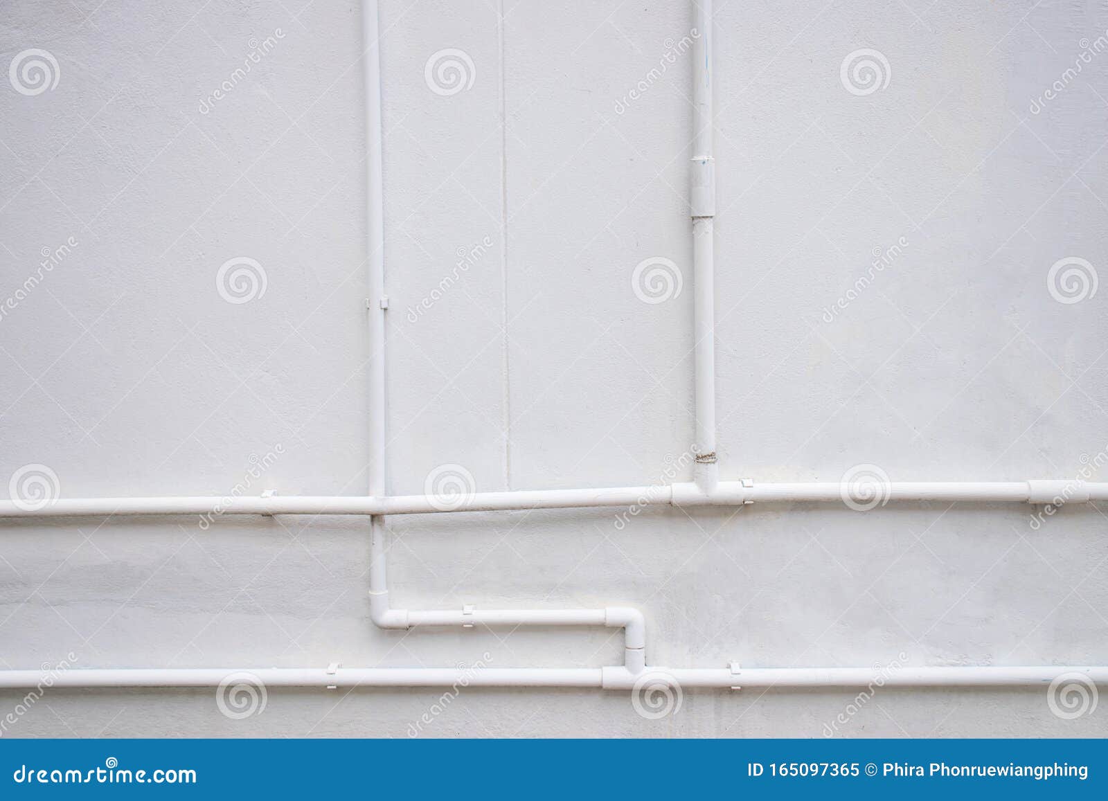 White Water Pipe System Installed on White Concrete Wall Stock Image
