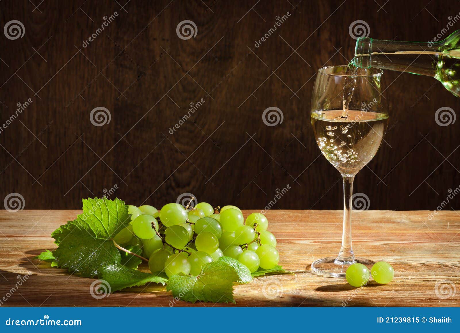 White Wine Pouring Down To the Glass with Grapes Stock Image Image of
