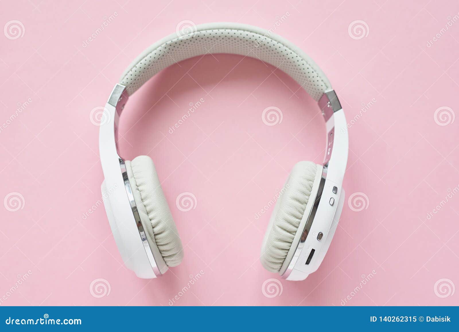 White Wireless Headphones on a Pastel Blue Background Stock Image