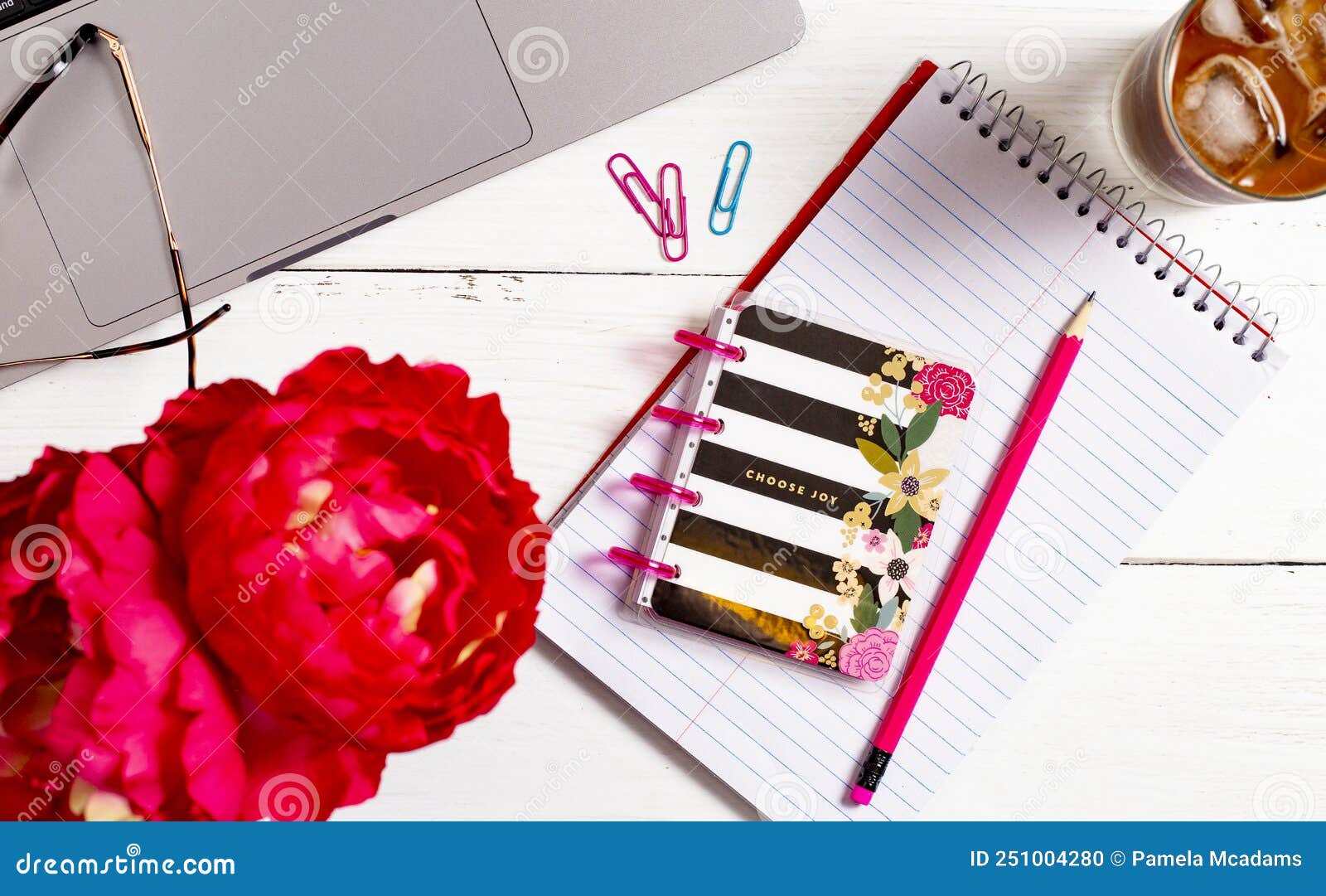 A White Wood Desk with a Computer and Other Supplies Stock Photo