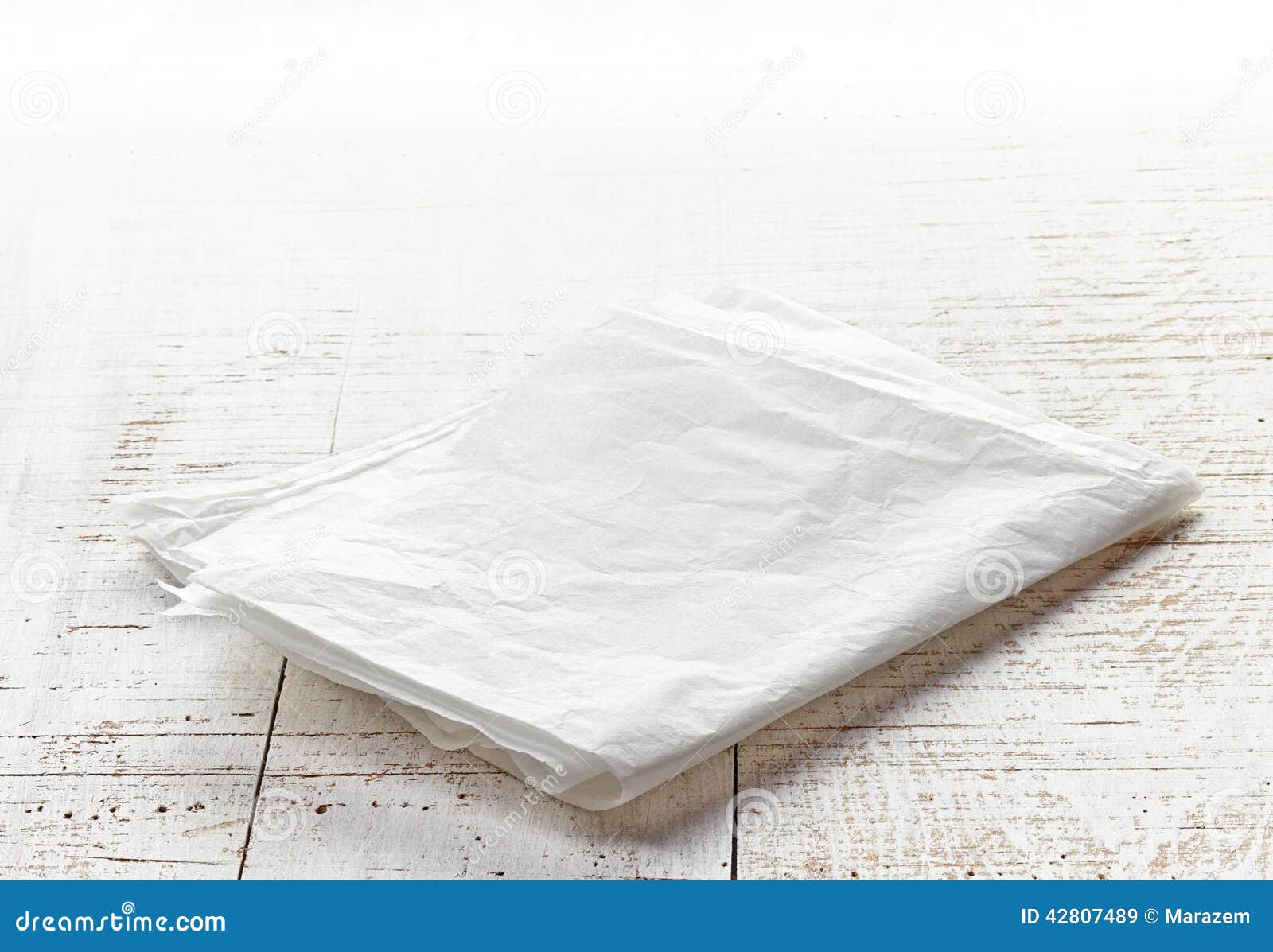 White Wrapping Paper on Wooden Table Stock Image - Image of wood