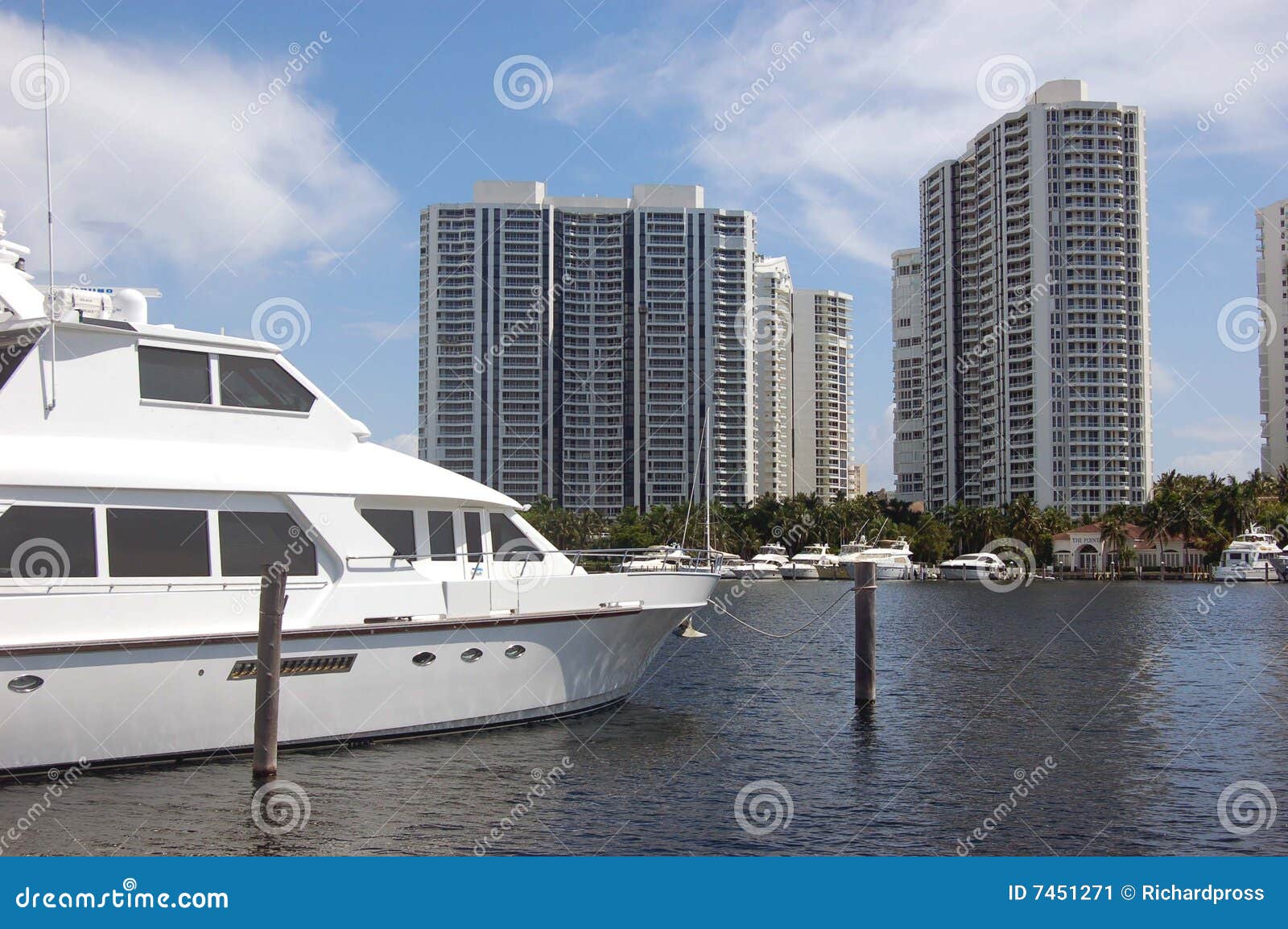 white yacht moored at an aventura,florida marina