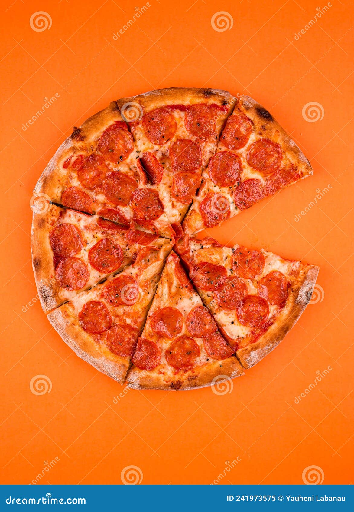 Whole, Cooked and Sliced Peperoni Pizza on a Bright Orange Background