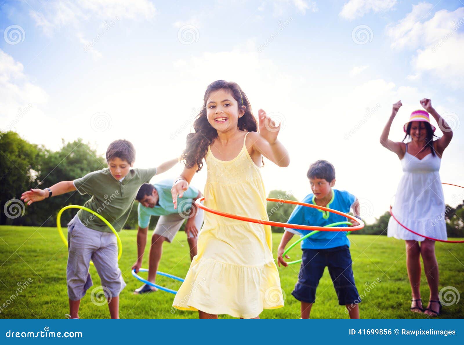 whole family hula hooping outdoors