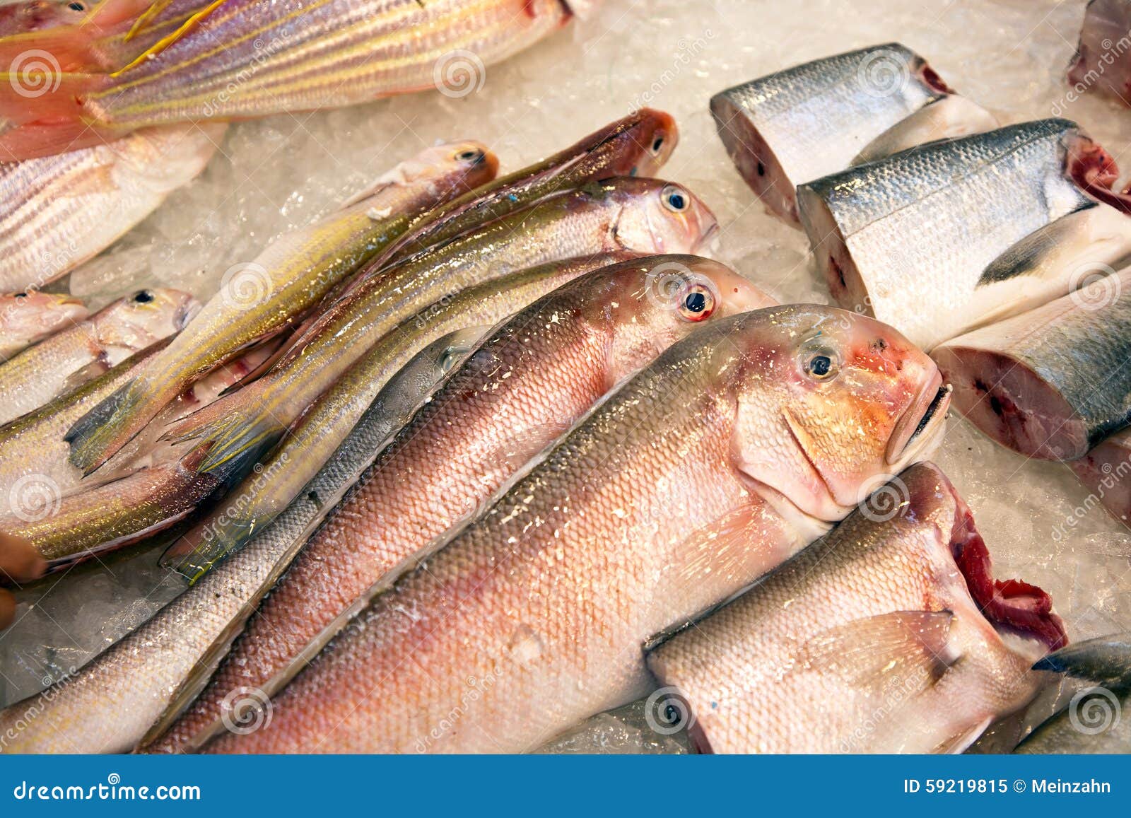 Whole Fresh Fishes Are Offered In The Fish Market In Asia Stock Image