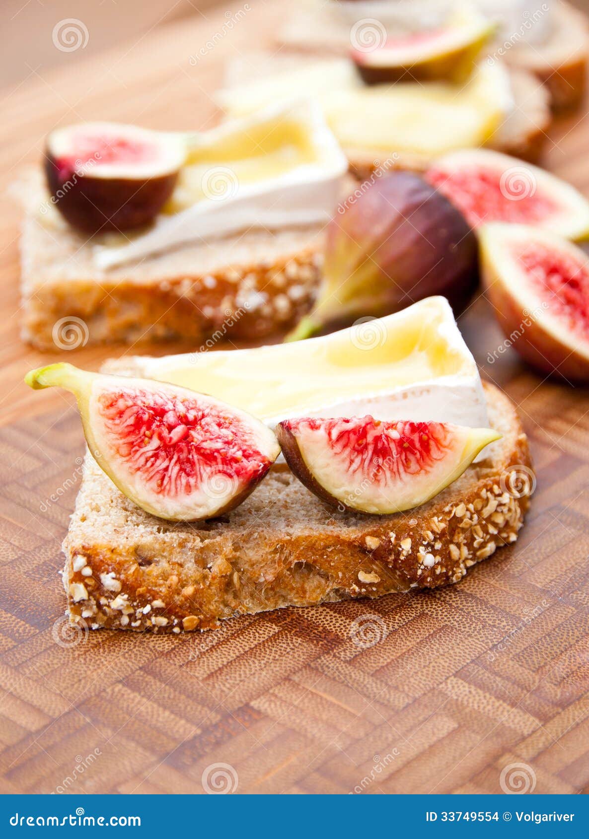 Whole Grain Bread with Melted Brie Cheese and Figs. Stock Photo Image
