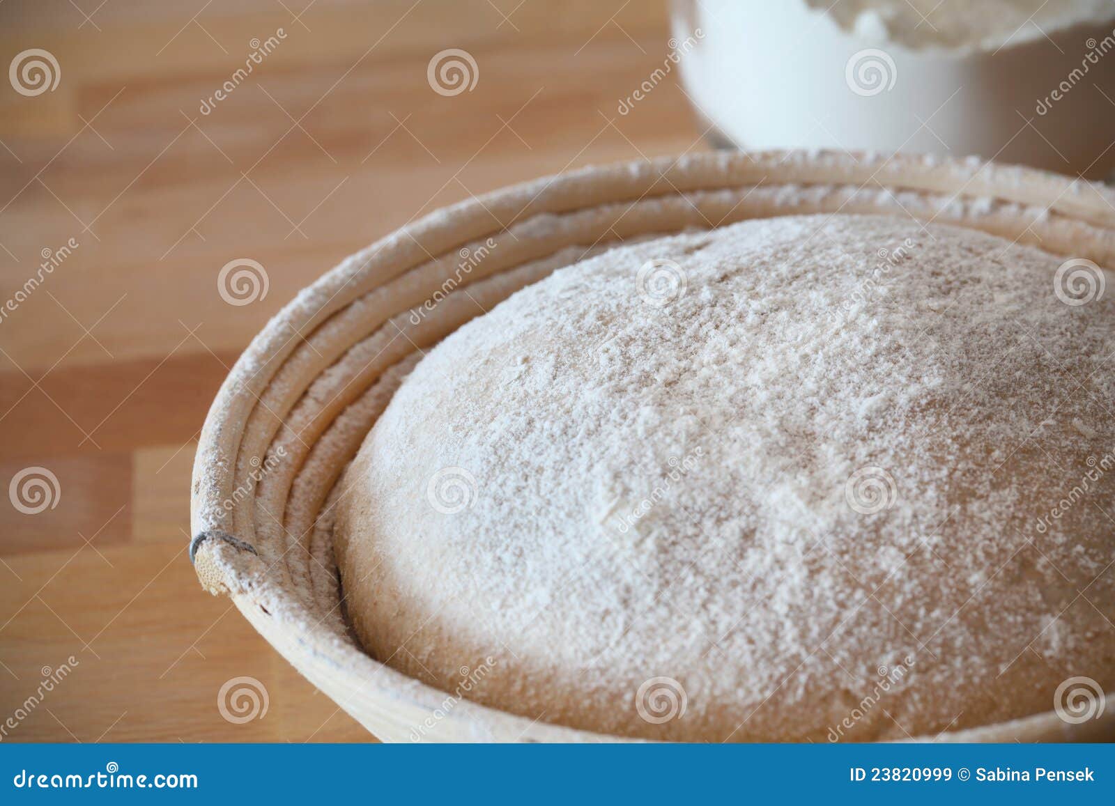 whole-grain dough proofing in a baneton basket