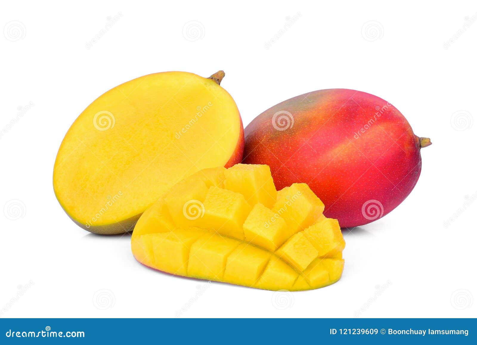 whole and half ripe mango fruit with mango cubes 