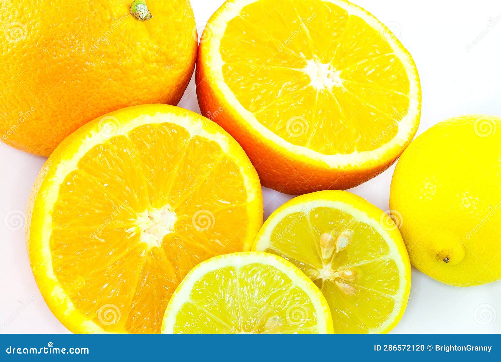 Whole and Halved Oranges and Lemons on White. Stock Photo Image of