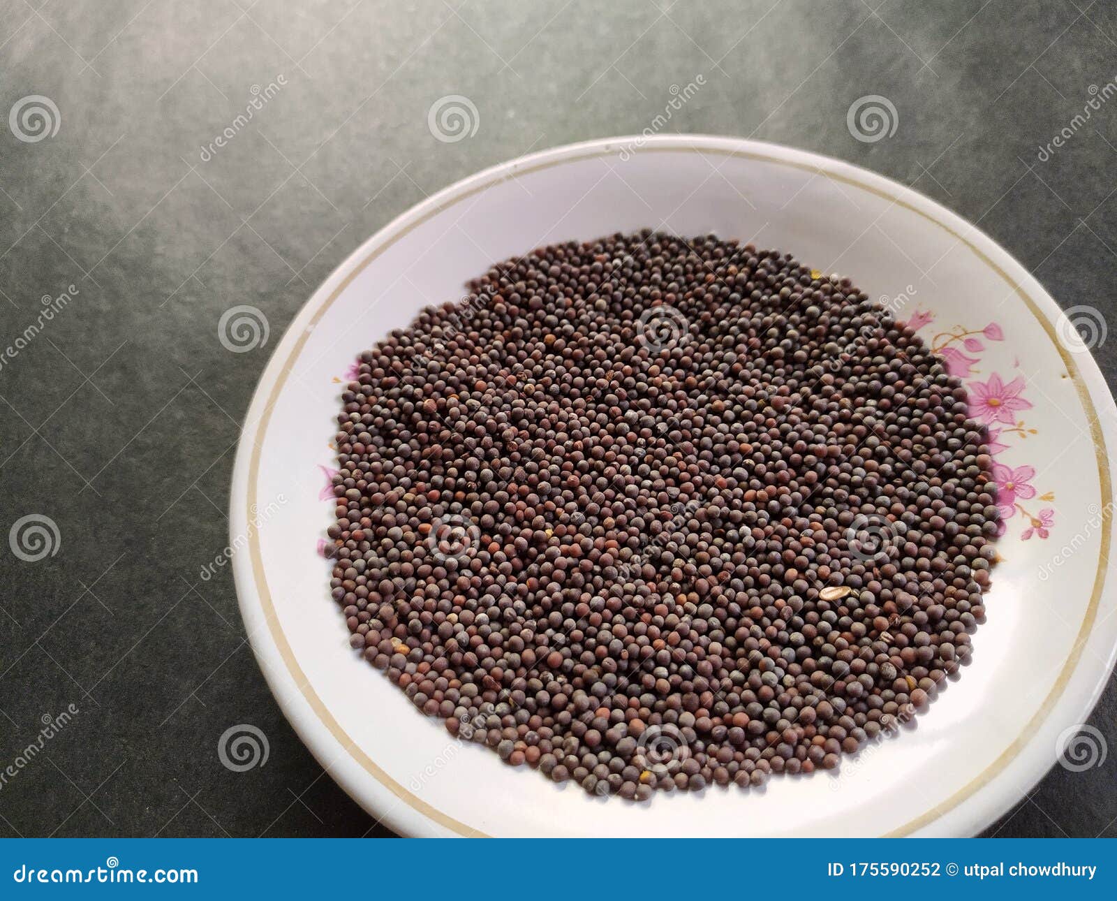 Whole Mustard Seed in a Plate, Black Background. Stock Photo Image of