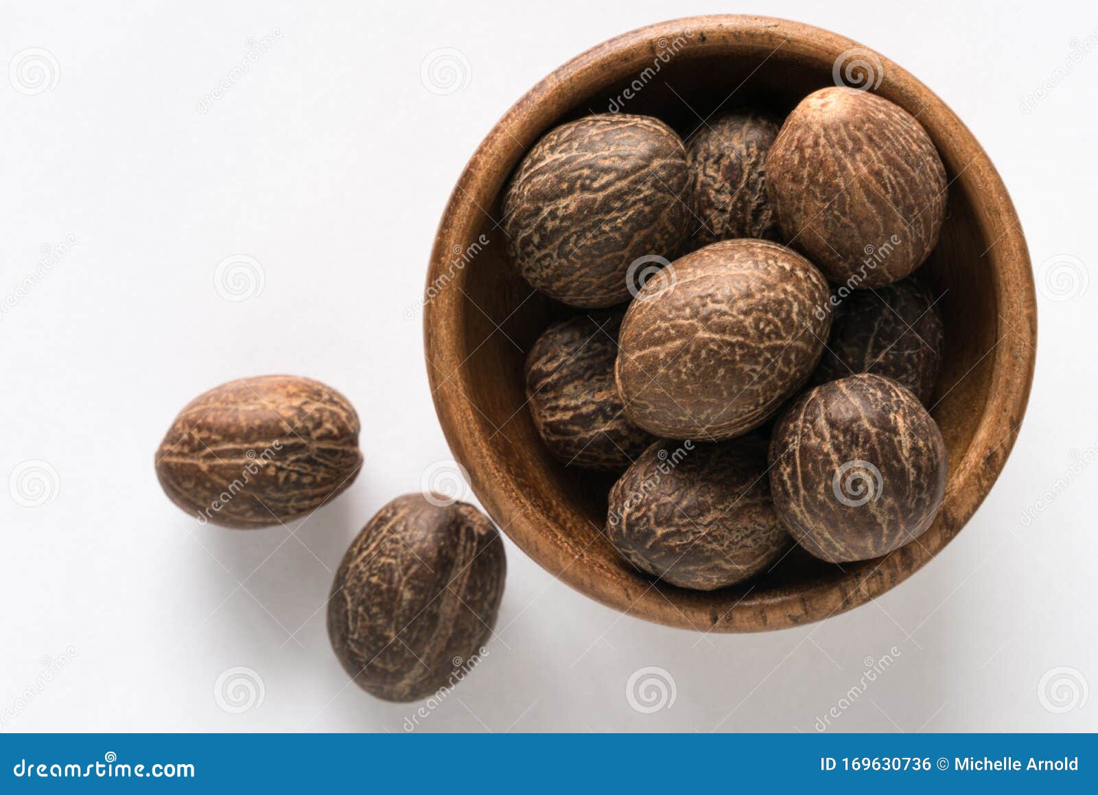 Whole Nutmeg in a Bowl stock photo. Image of view, isolated 169630736