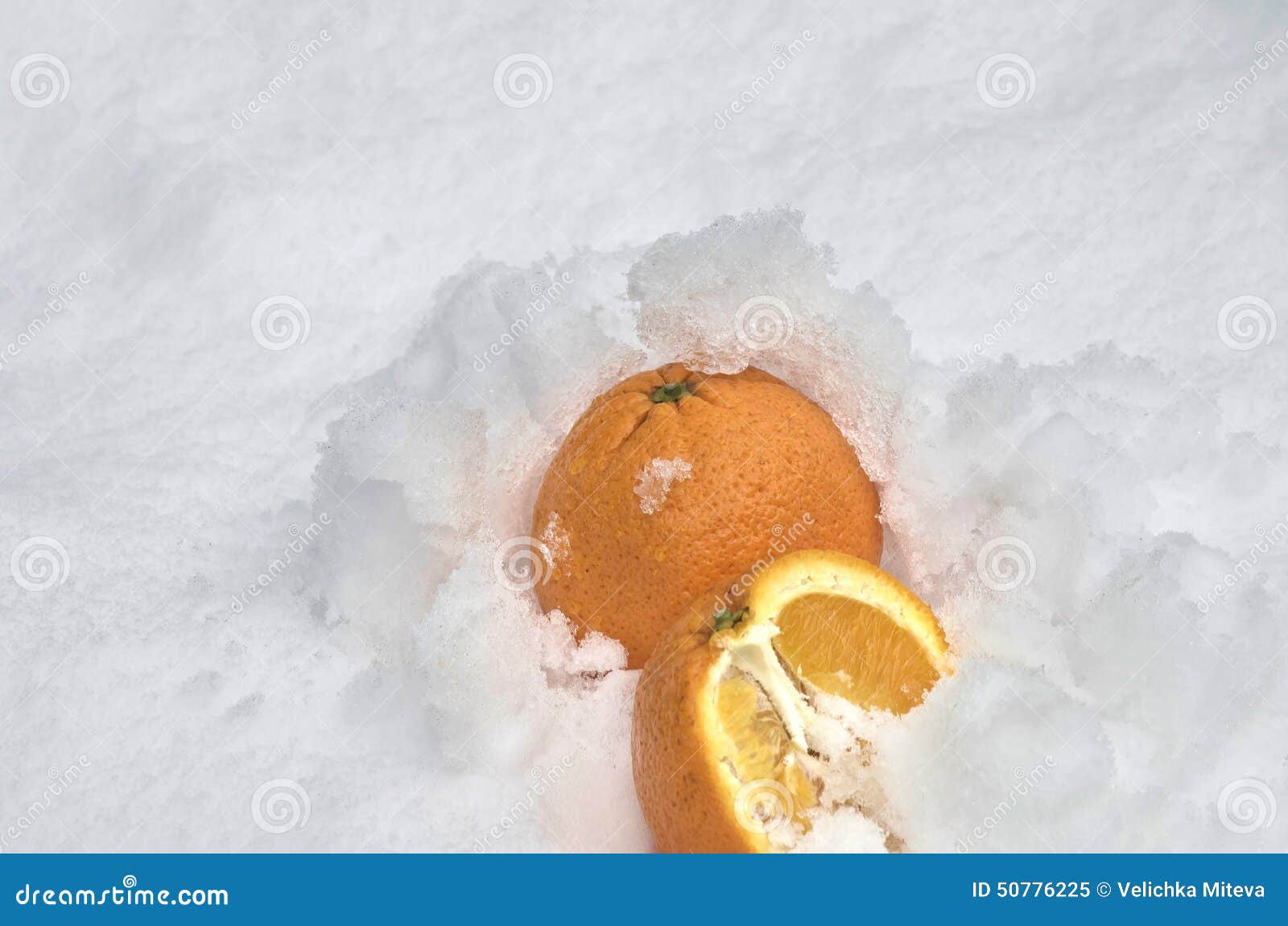Whole Orange and Half Orange Fruit Refrigerate in the Snowdrift at