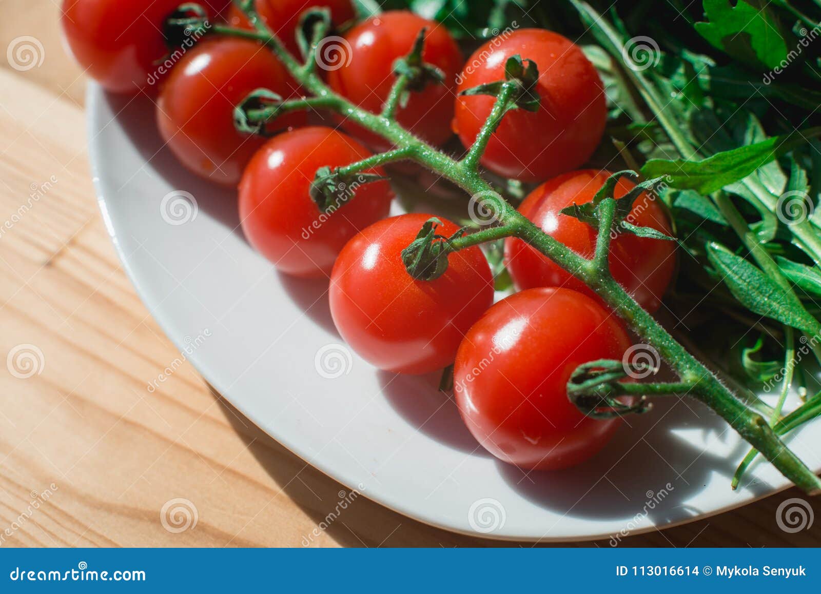Whole Tomato Cherry and Fresh Leaves Composition on a White Plate on the Wooden Table Stock Photo - Image pesto, isolated: 113016614