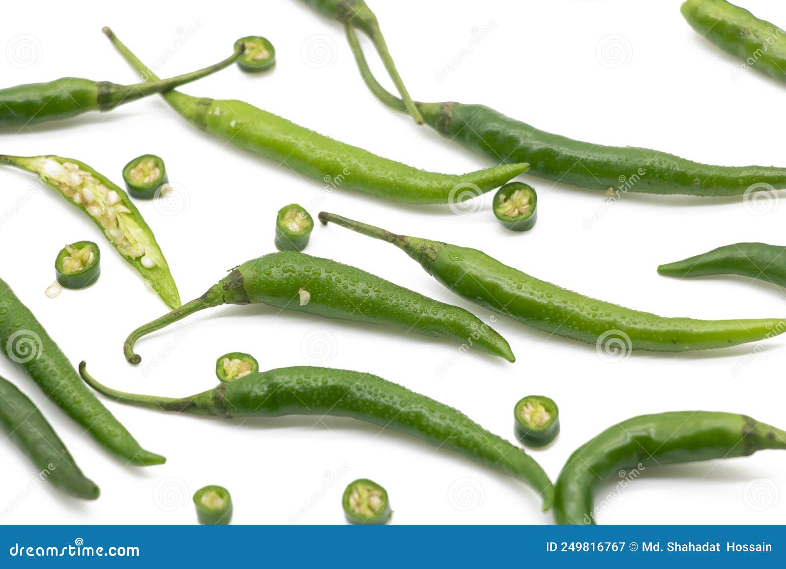 whole and slices lumbre green chili pepper  on white background