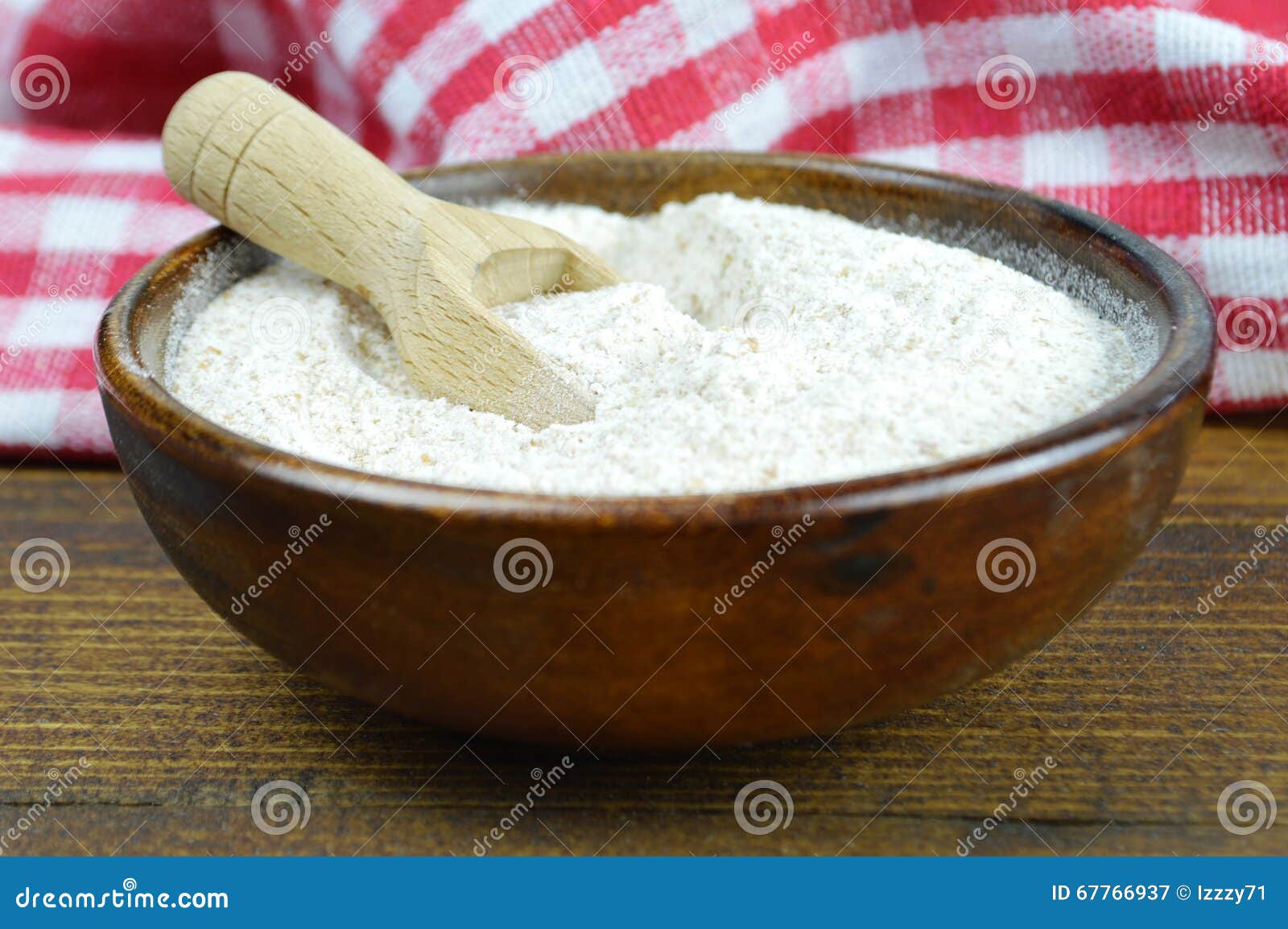 whole wheat flour in wooden bowl