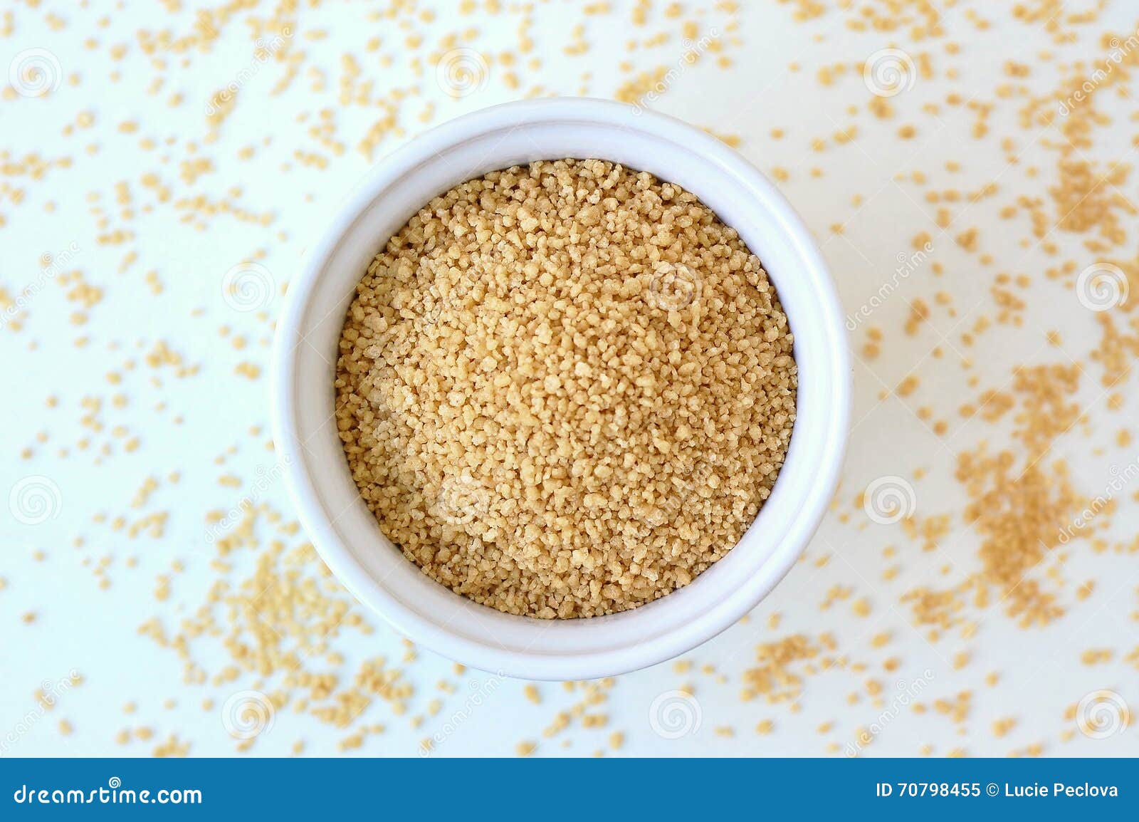 Wholegrain Couscous in the Bowl on the White Background Stock Image