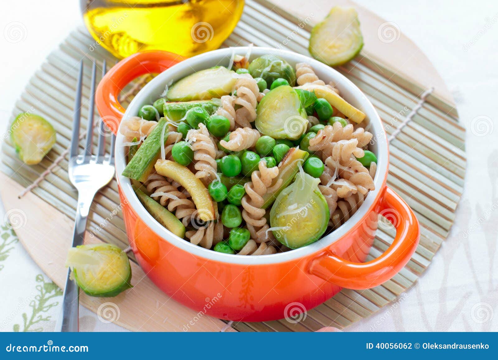 Wholegrain Pasta with Green Vegetables in Ceramic Pan Stock Photo