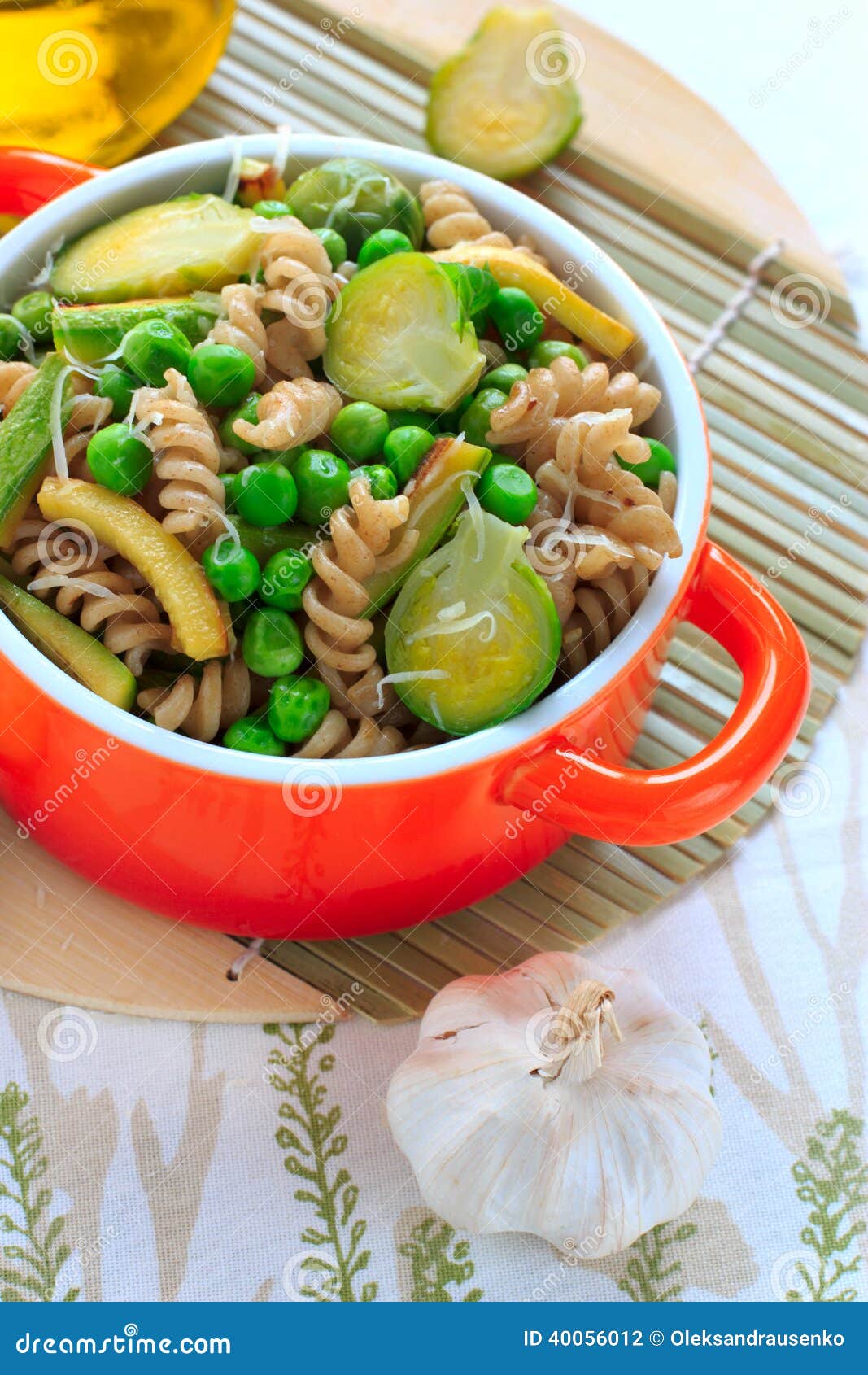 Wholegrain Pasta with Green Vegetables in Ceramic Pan Stock Photo