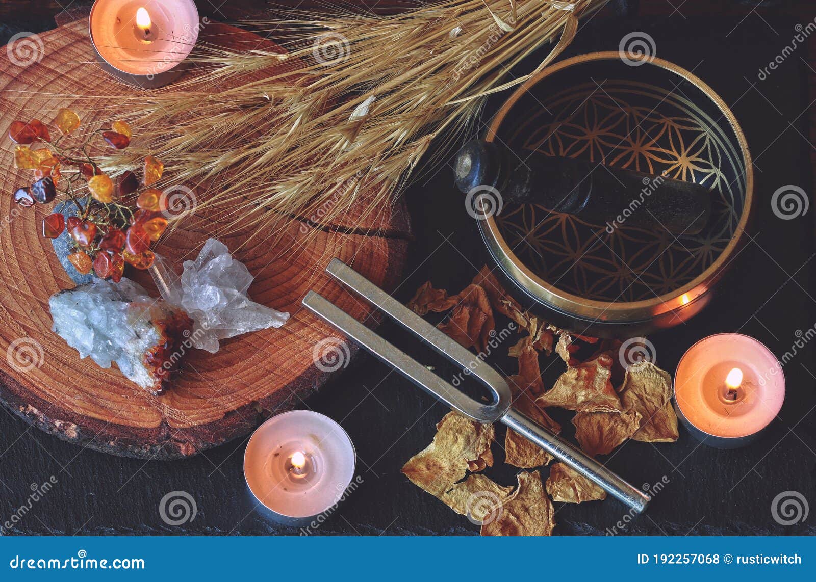 wiccan witch altar prepared for sound healing magick with 741hz tuning fork and tibetan singing bowl