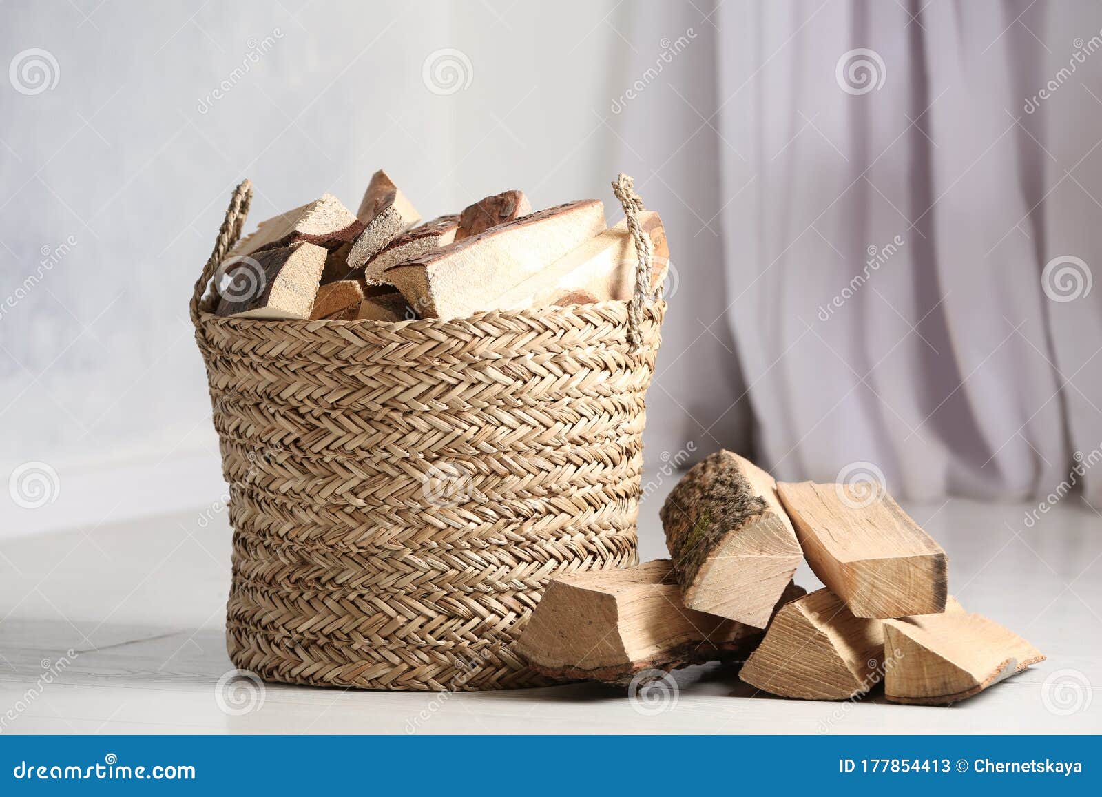 Wicker Basket with Cut Firewood on White Floor Stock Image Image of