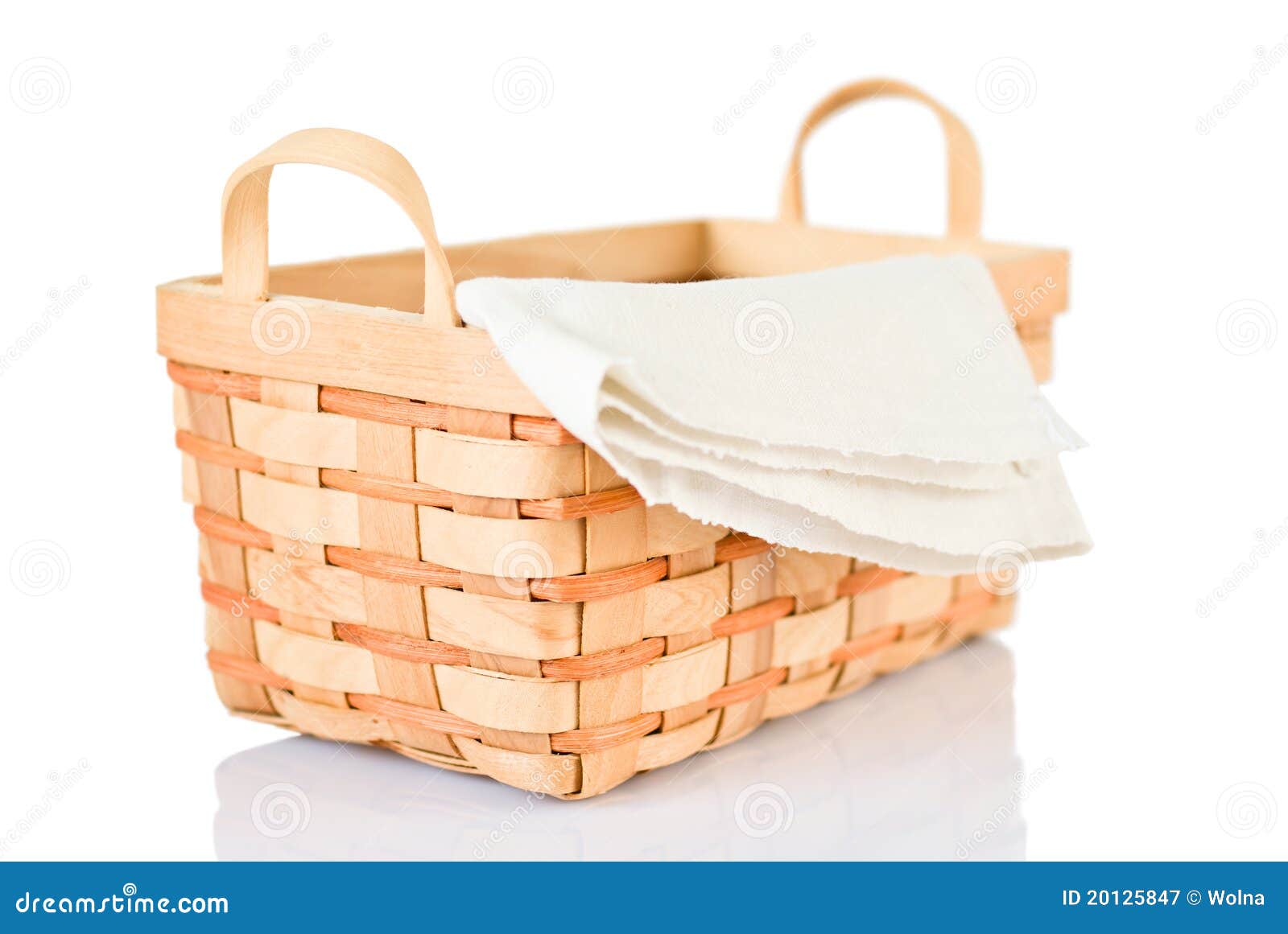 wicker basket and napkin on white