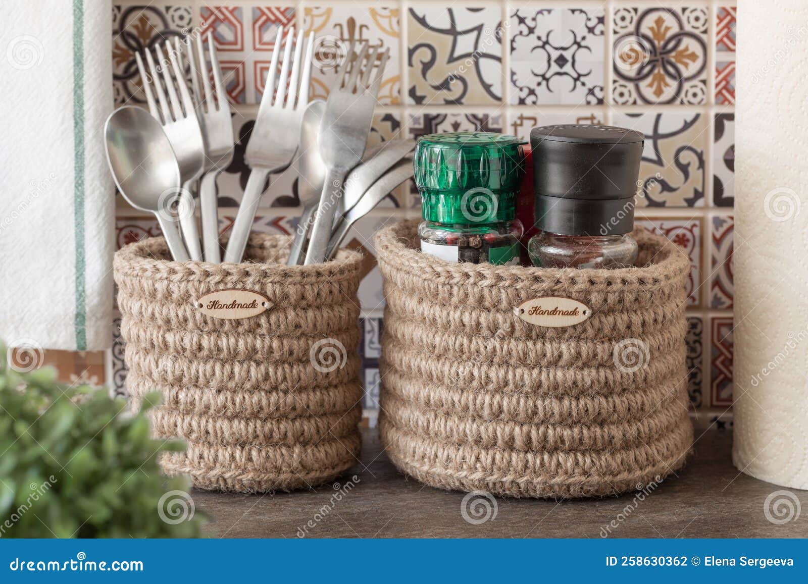 Wicker Containers in the Kitchen, Cutlery and Spices in Baskets on the