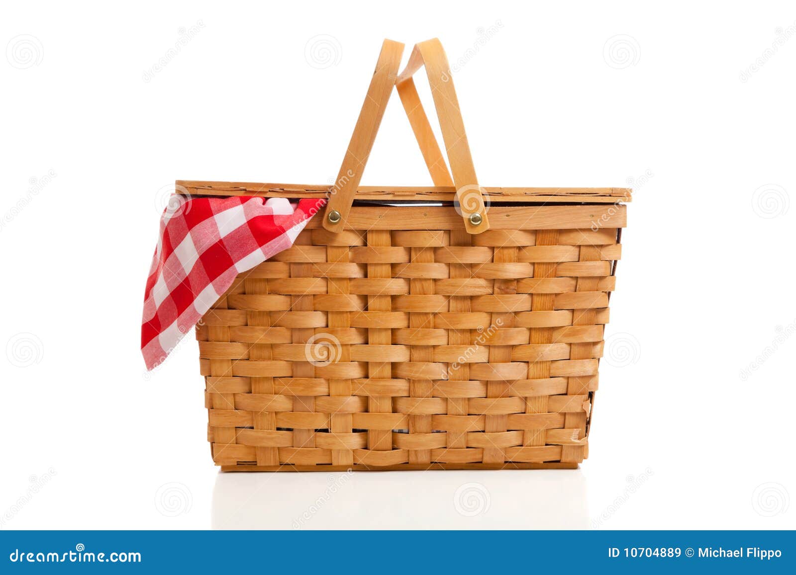 wicker picnic basket with gingham cloth