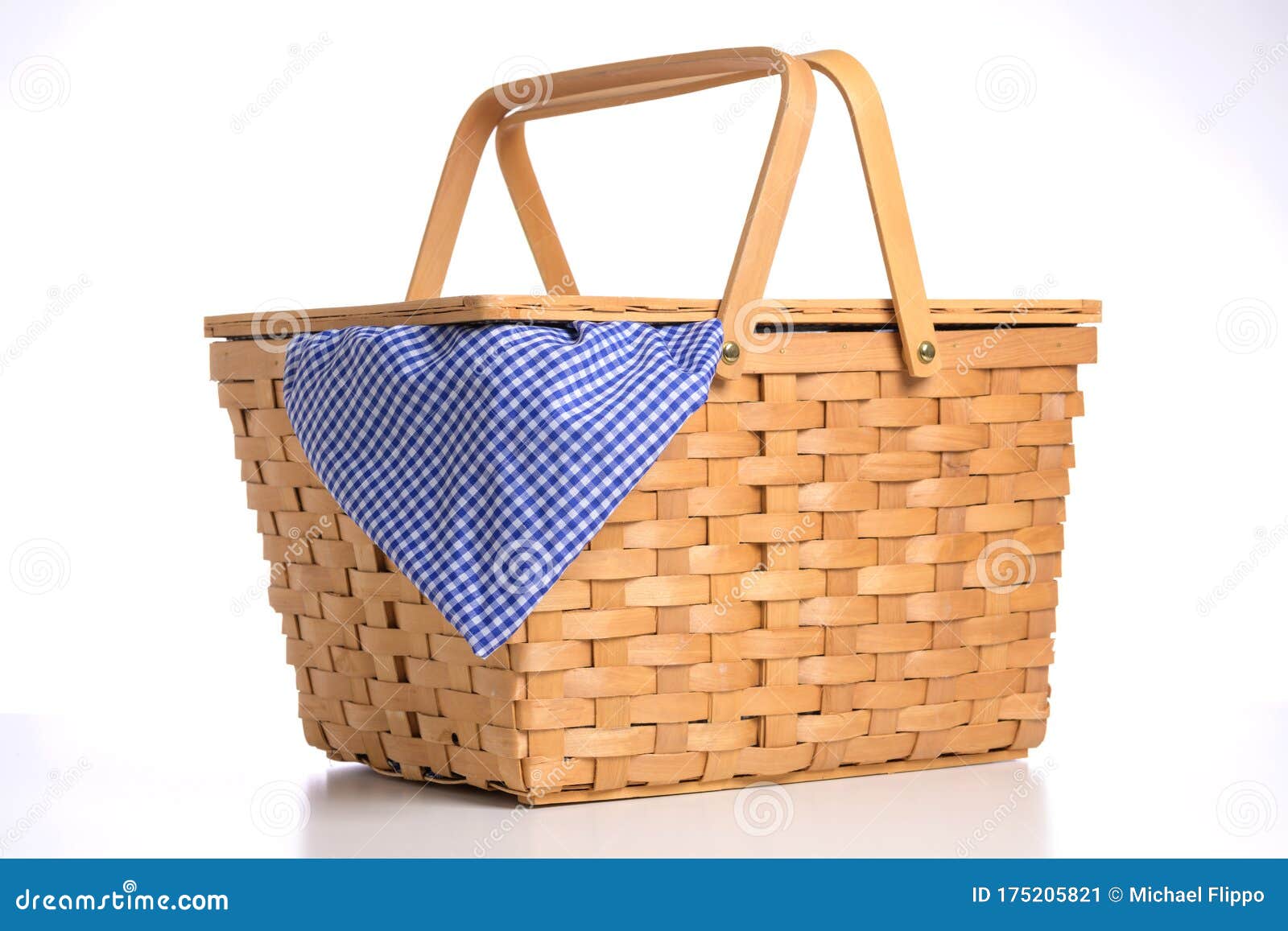 Wicker Picnic Basket on a White Background with Blue Gingham Tablecloth