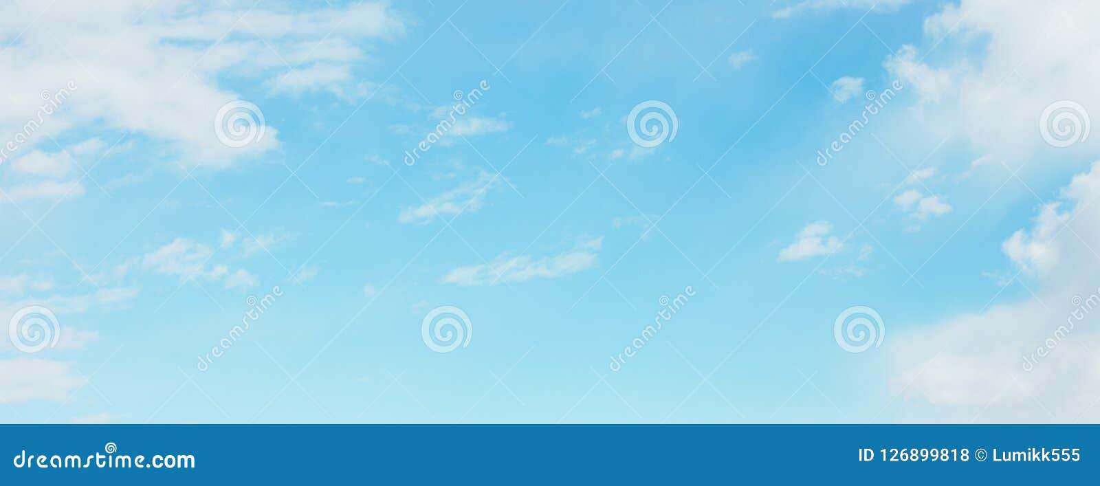 wide angle blue sky wallpaper with soft white clouds