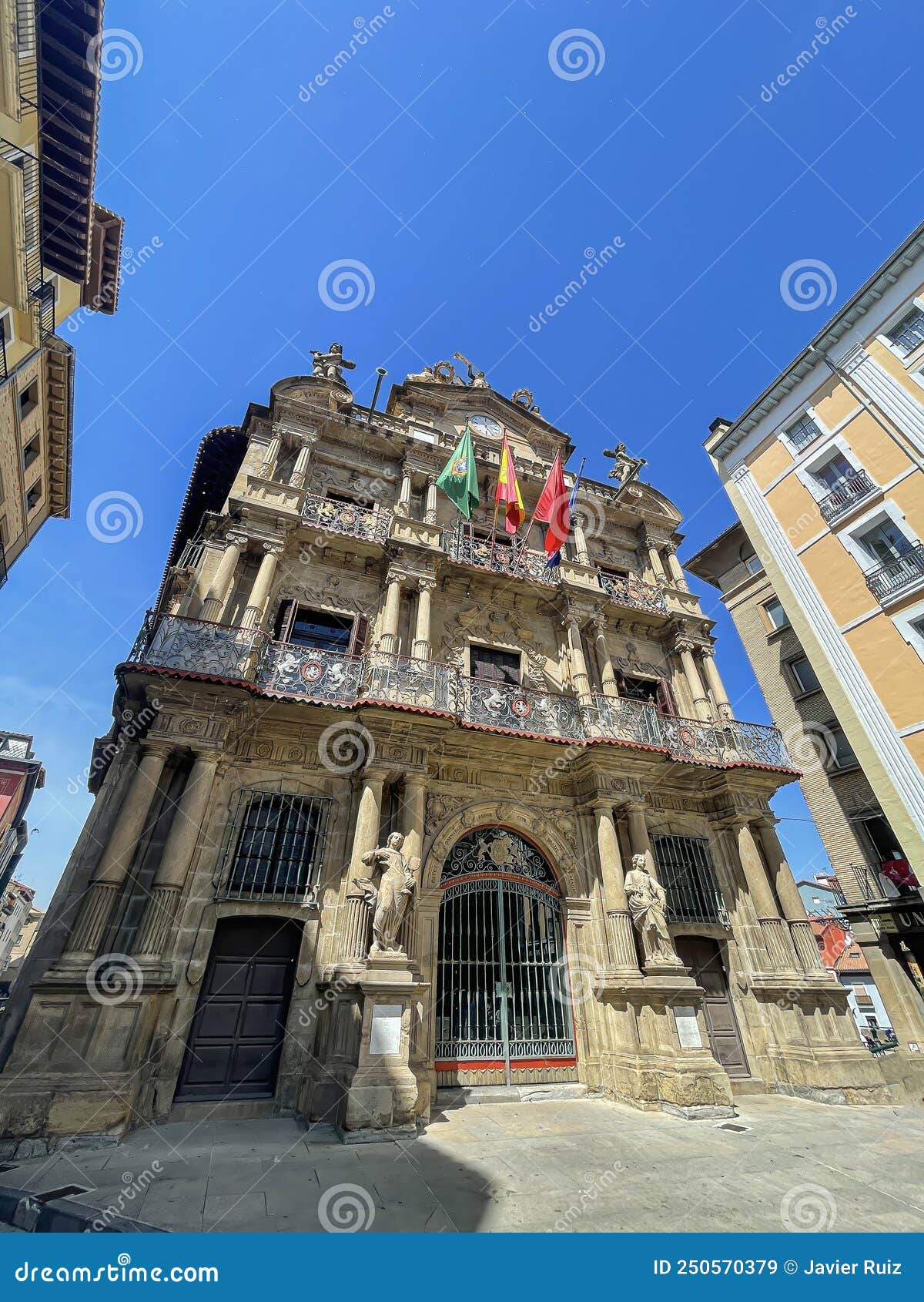 wide angle view of the main facade of the pamplona city hall, navarra, spain, vertical contrapicado point of view, low angle view