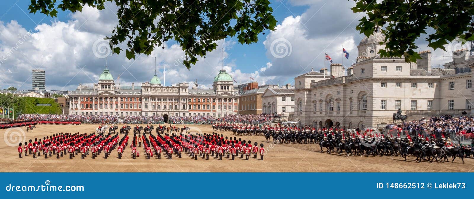 wide angle view of the trooping the colour military parade at horse guards parade, london uk, with household division soldiers.