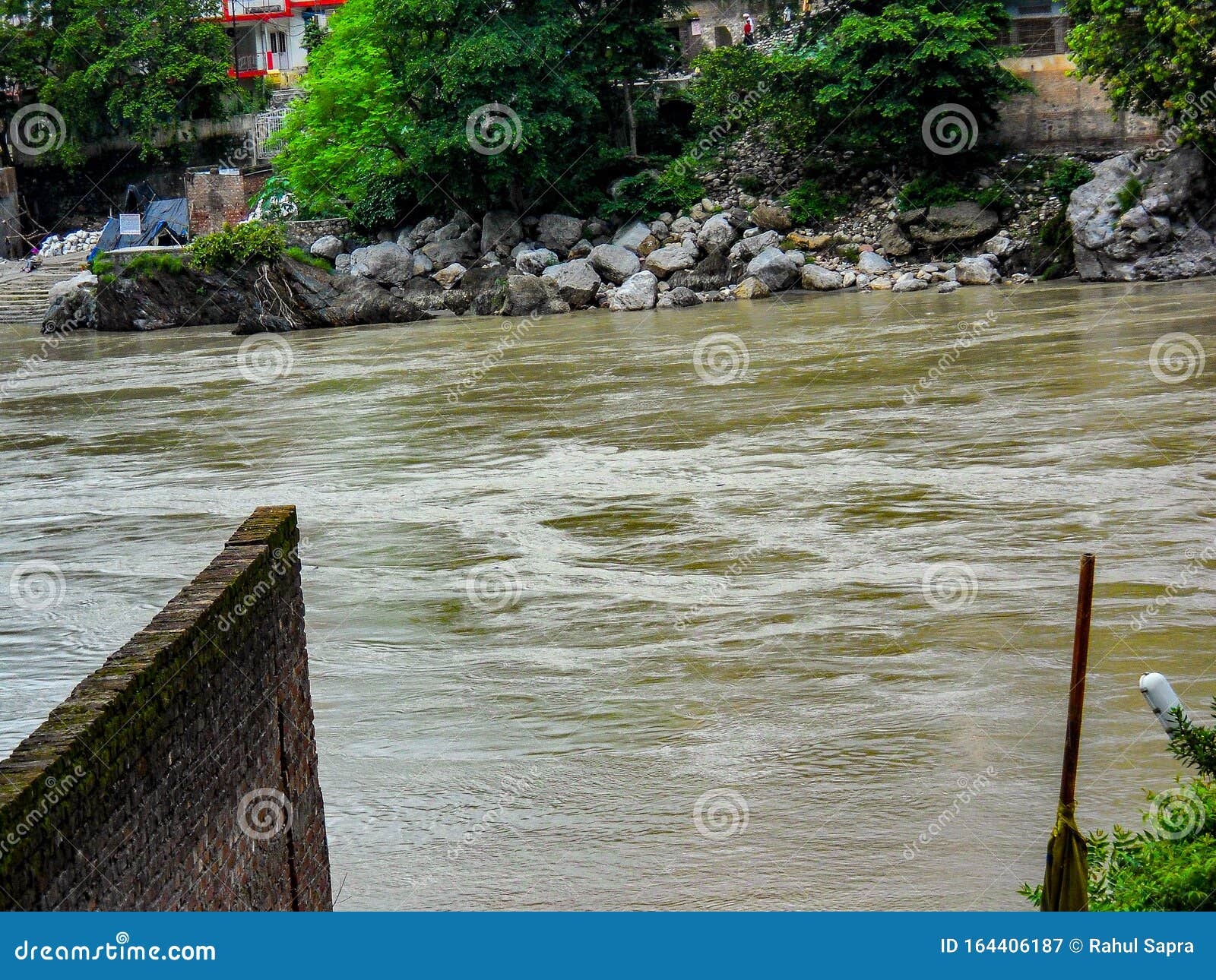 wide ganga river flowing having brown colour water in haridwar india