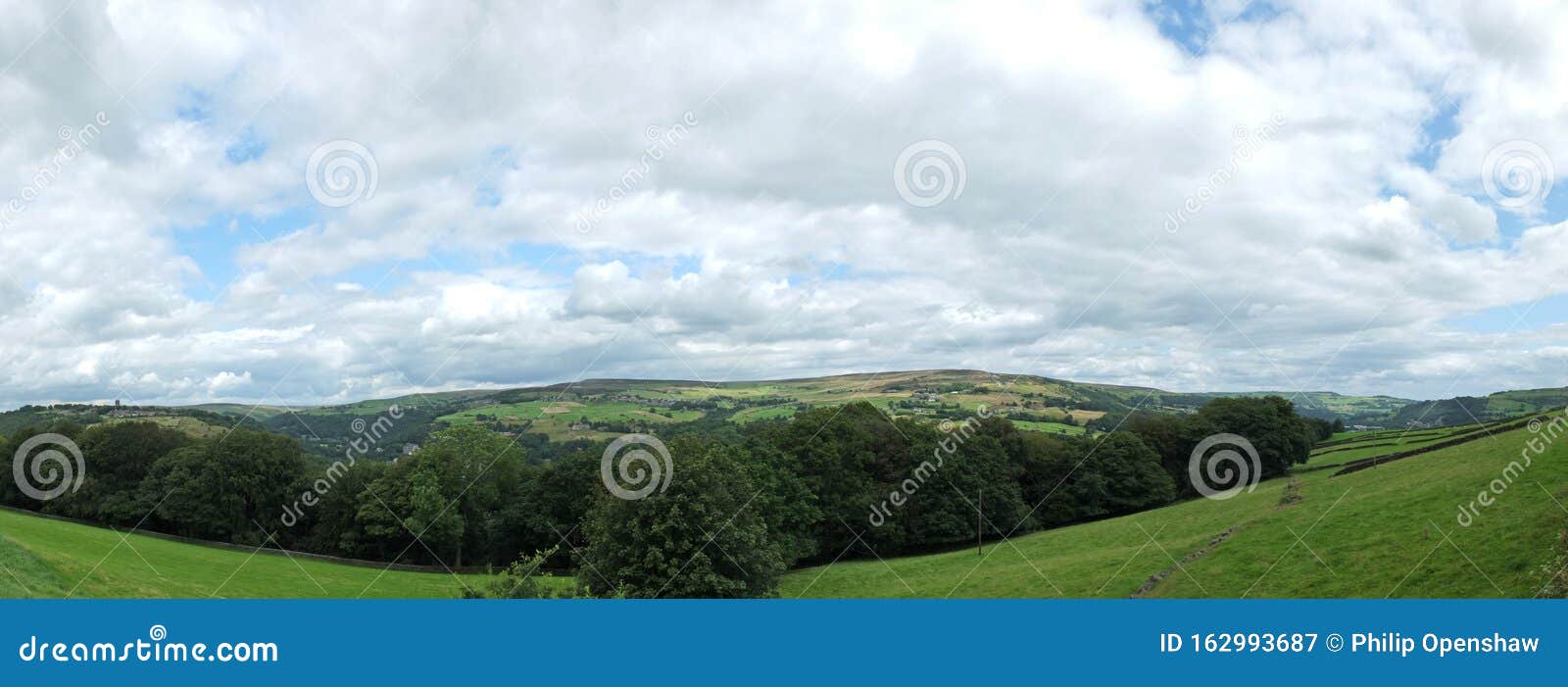 a wide panoramic view of the calder valley with the village of heptonstall and the towns of hebden bridge and mytholmroyd visible