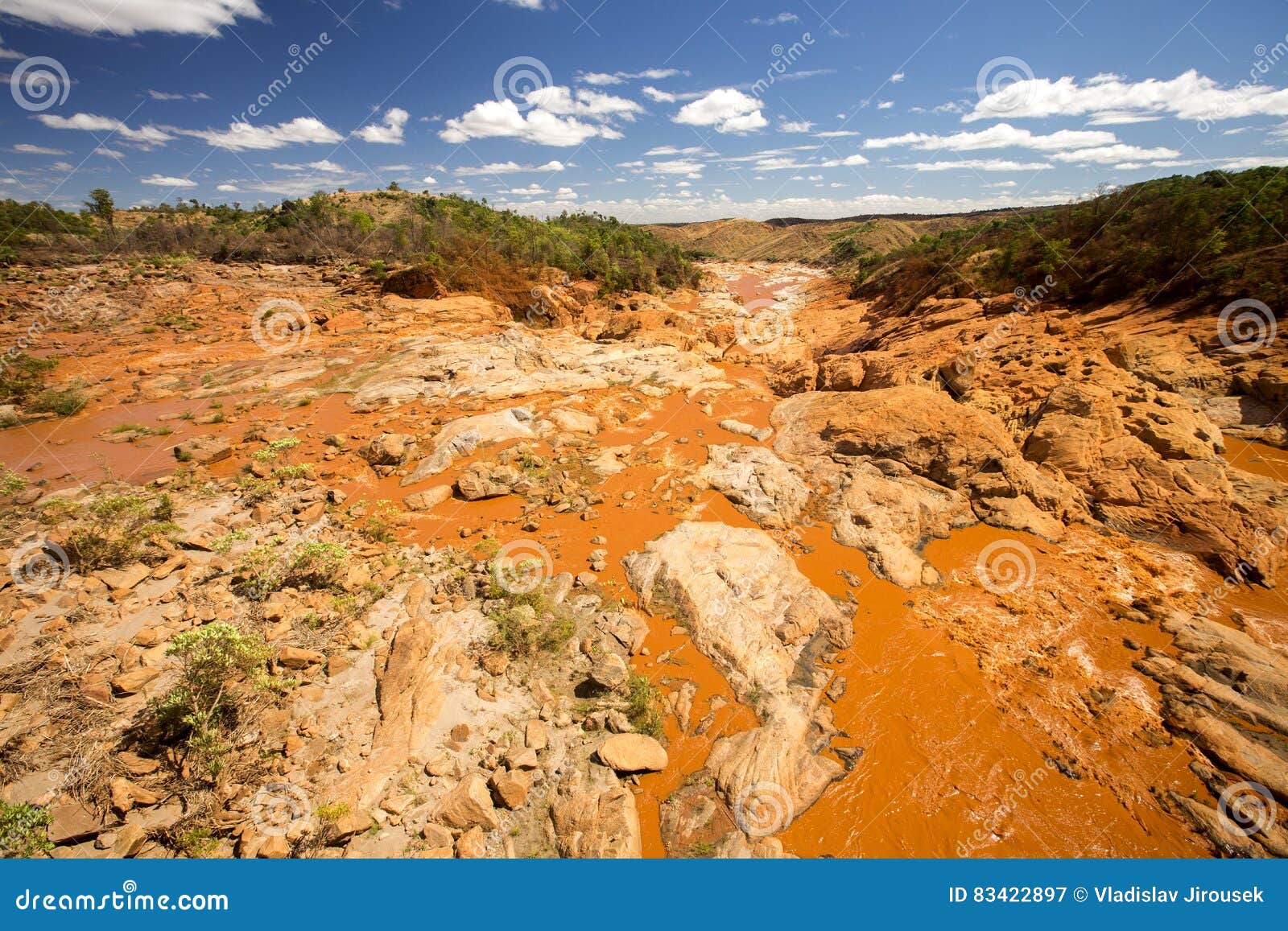 wide river bed betsiboka, flushes red soil after heavy rains in madagascar