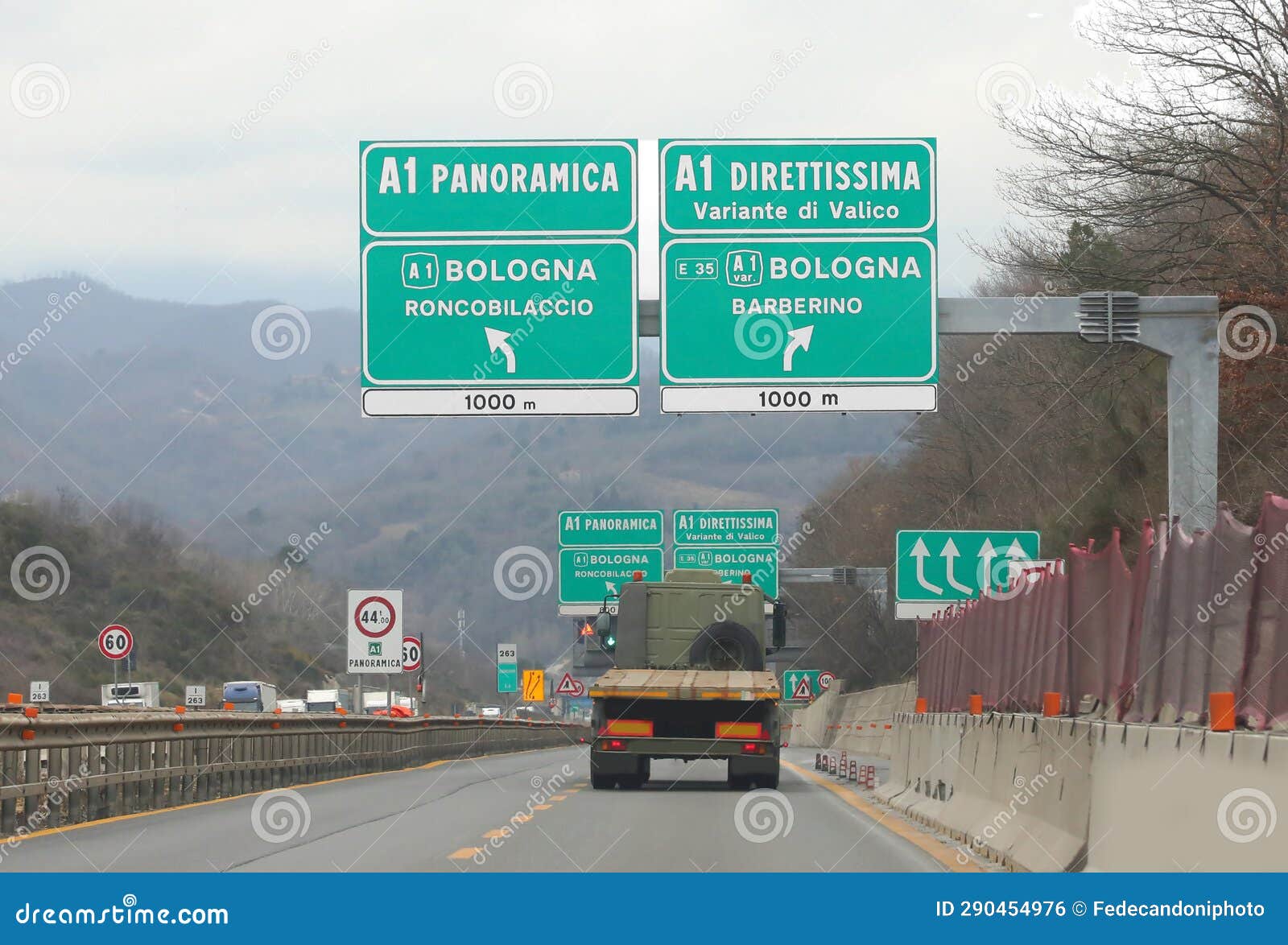 wide road sign in the italian motorway with place of city and two way to tuscany